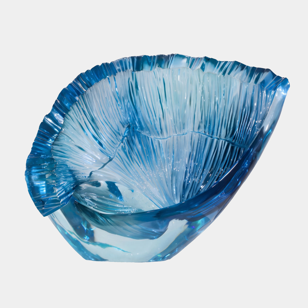 Blue Ribbed Fan Shell Resin Sculpture - 75cm, a clear blue shell form with deep radiating ribs and a jagged lip, resting on its hinge against a plain white background.