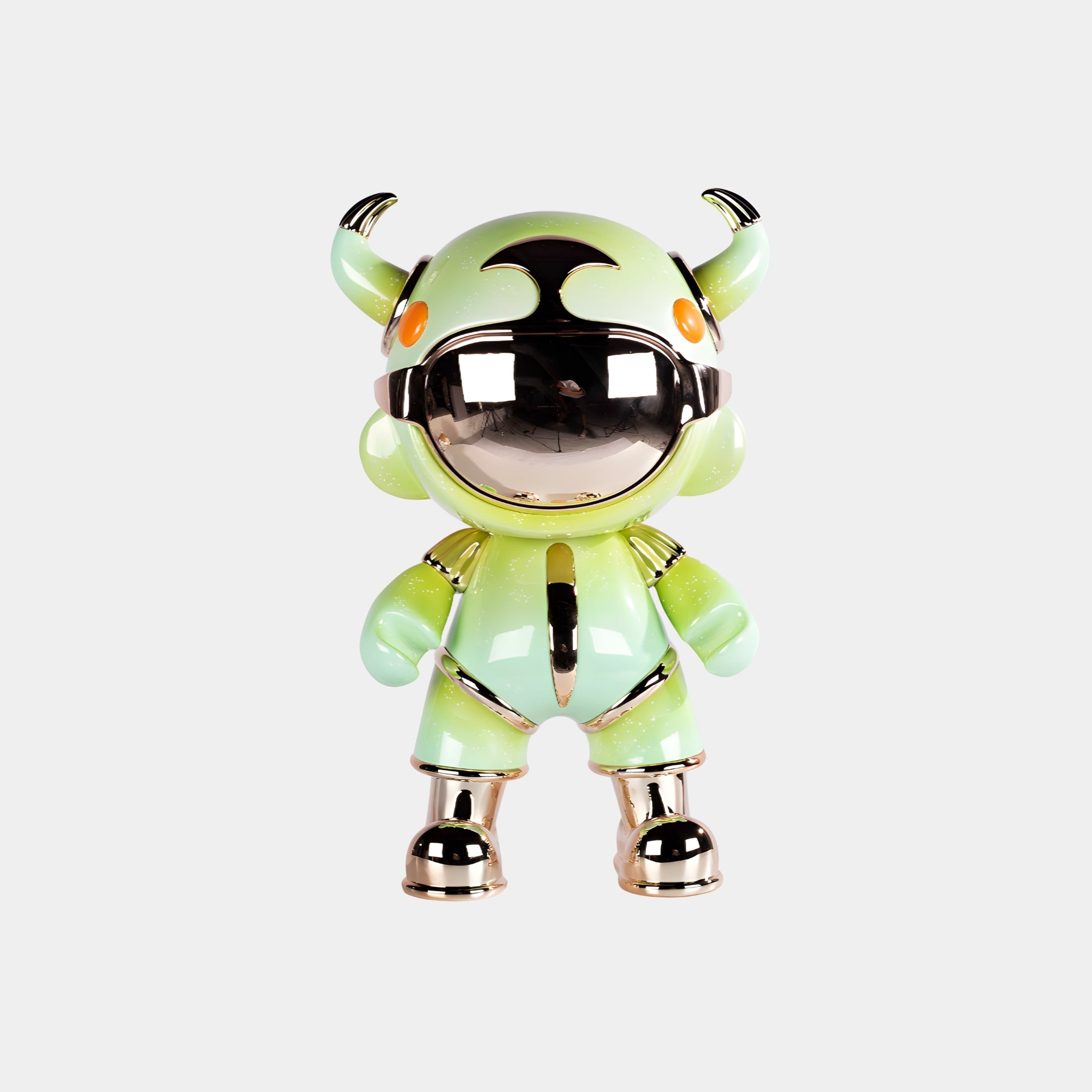 The Mint Green Suit Astro Devil Figure - 48cm by Giant Sculptures features a reflective silver faceplate, orange eyes, black-tipped horns, and metallic gold accents on its hands, feet, and joints, posed against a plain white background.