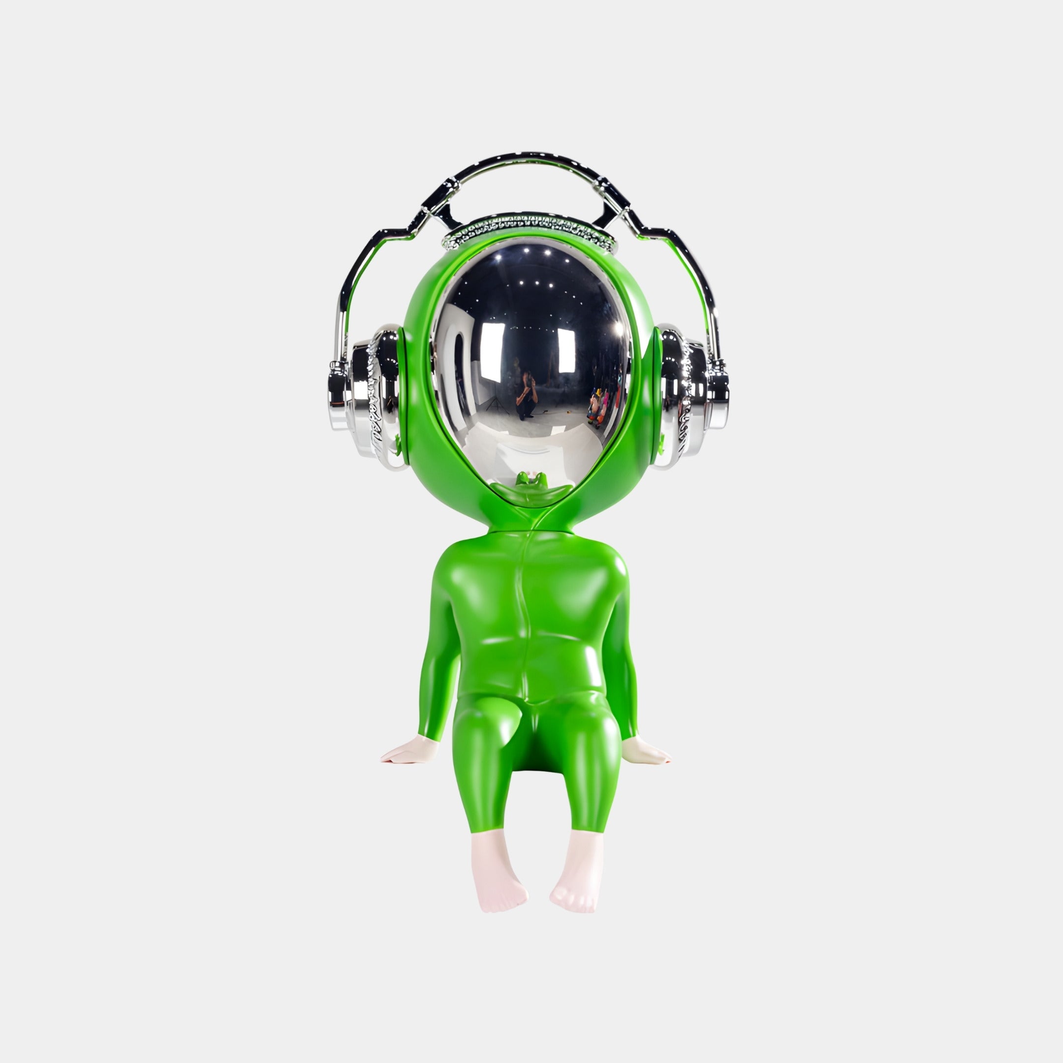 The Neon Green Alien Beats Figure - 55cm by Giant Sculptures features a glossy alien in a spacesuit with a reflective helmet and silver headphones, seated with hands by its sides—an eye-catching contemporary art decor piece.