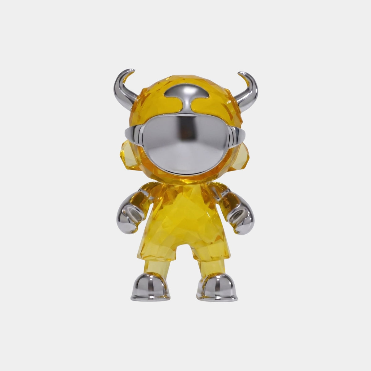 The Giant Sculptures Solar Yellow Chrome Astro Devil Figure - 15cm features an astronaut-inspired design with horns, a large reflective visor, and chunky limbs, shown standing upright against a plain white background.