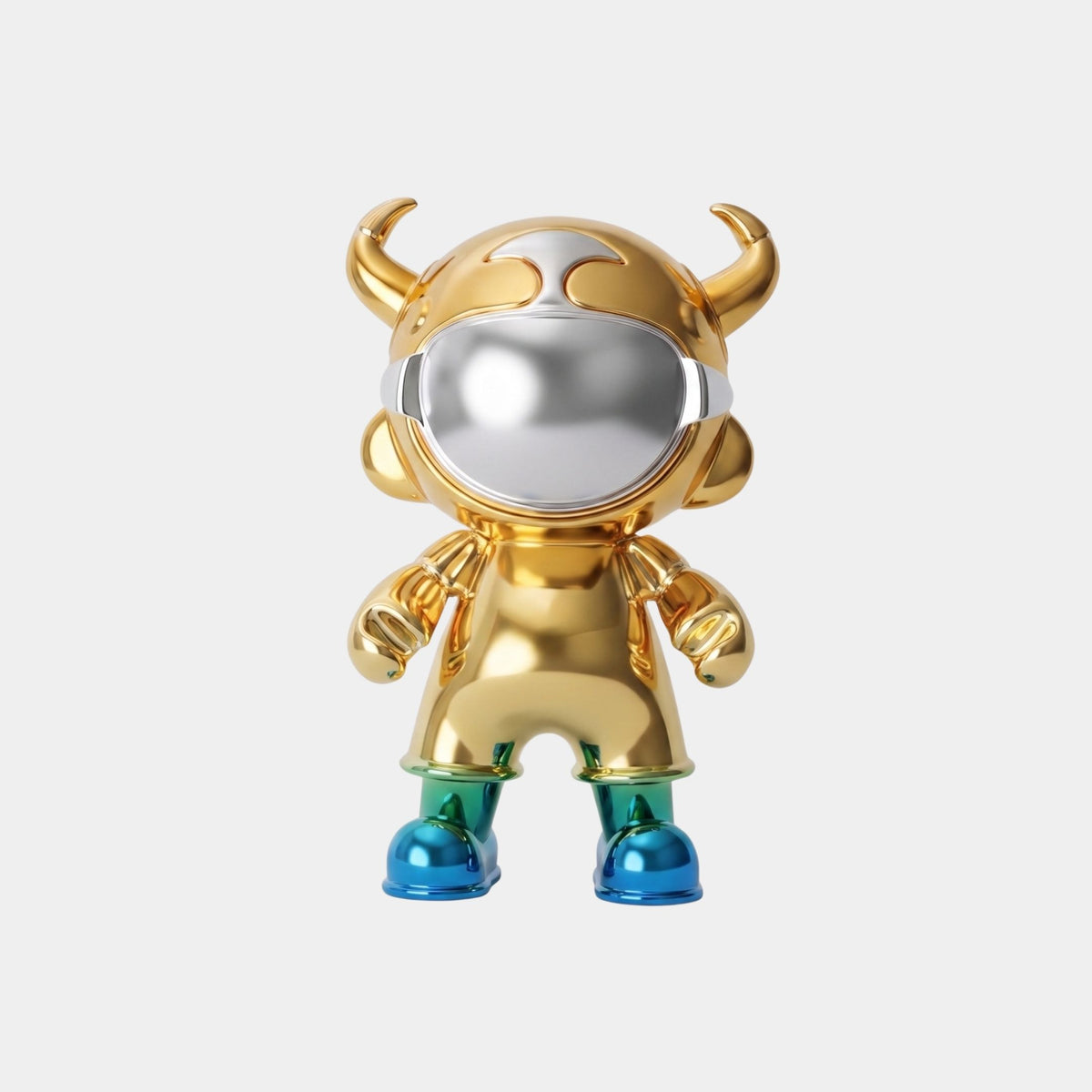 The Gold & Teal Electroplated Astro Devil Figure (35cm) by Giant Sculptures features a shiny gold helmet with distorted reflections, horns, green legs, and blue shoes, standing against a plain white background.