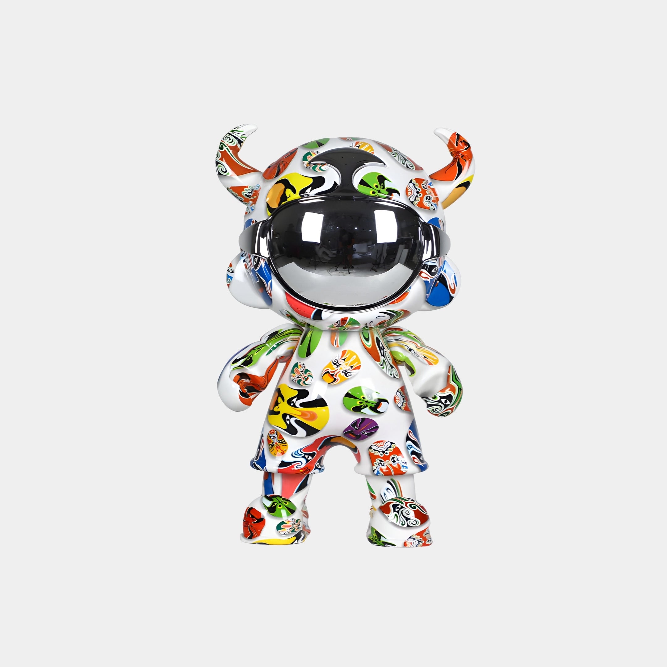 The Doodle Pop Astro Devil Figure - 35cm by Giant Sculptures is a glossy collectible featuring a horned humanoid with a chrome faceplate and vibrant abstract patterns on white.