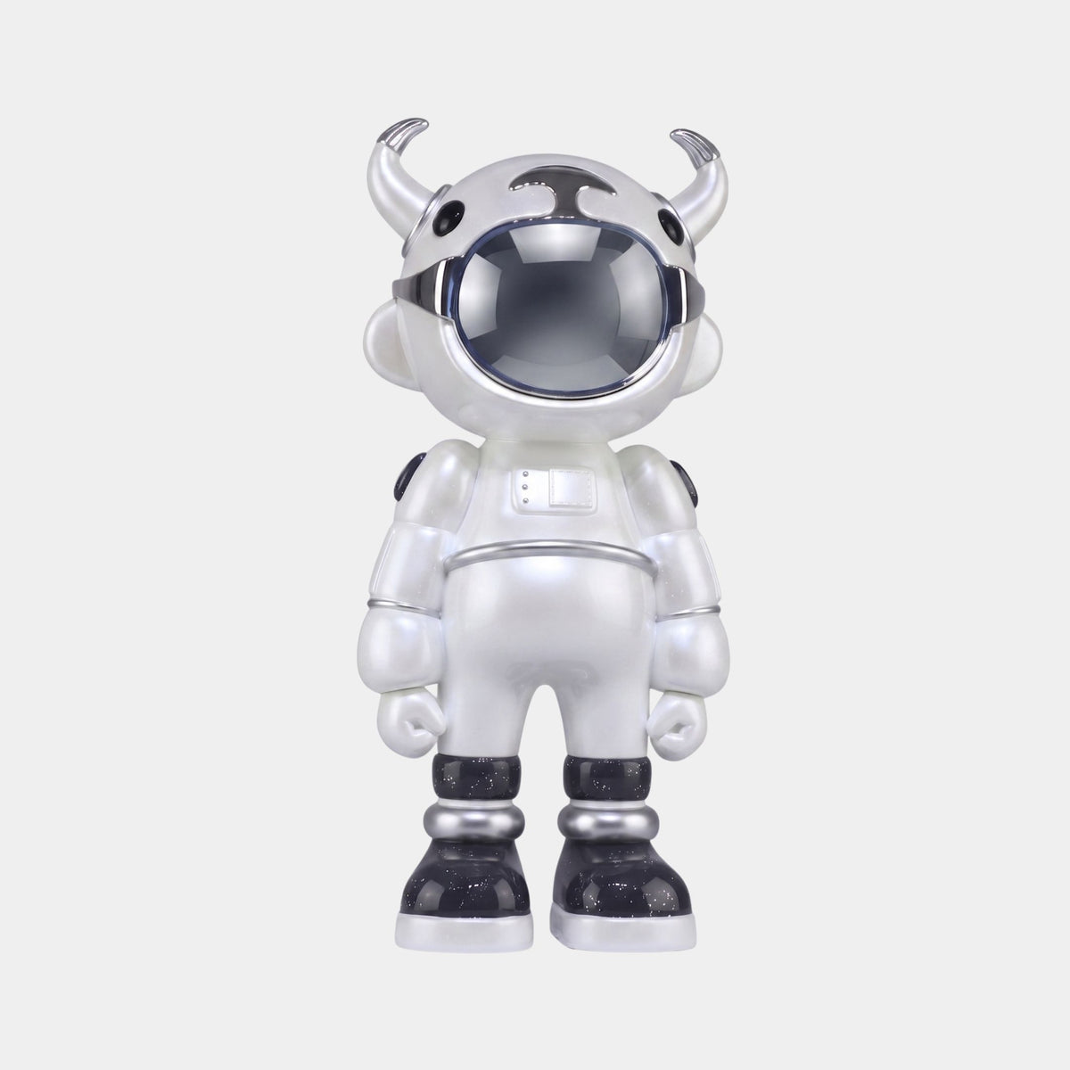The Chrome Astro Robot Sculpture (70cm) by Giant Sculptures is a designer art toy figure blending cow and astronaut features, with a pearlescent white suit, black accents, shiny visor, and helmet horns, standing upright against a white background.