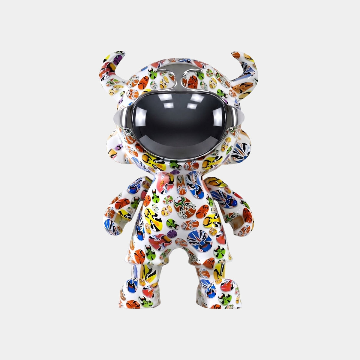 The Doodle Pop Astro Devil Sculpture (80cm) by Giant Sculptures features a horned humanoid with a reflective visor and colorful butterfly-like patterns—an eye-catching addition to your fiberglass astronaut decor.