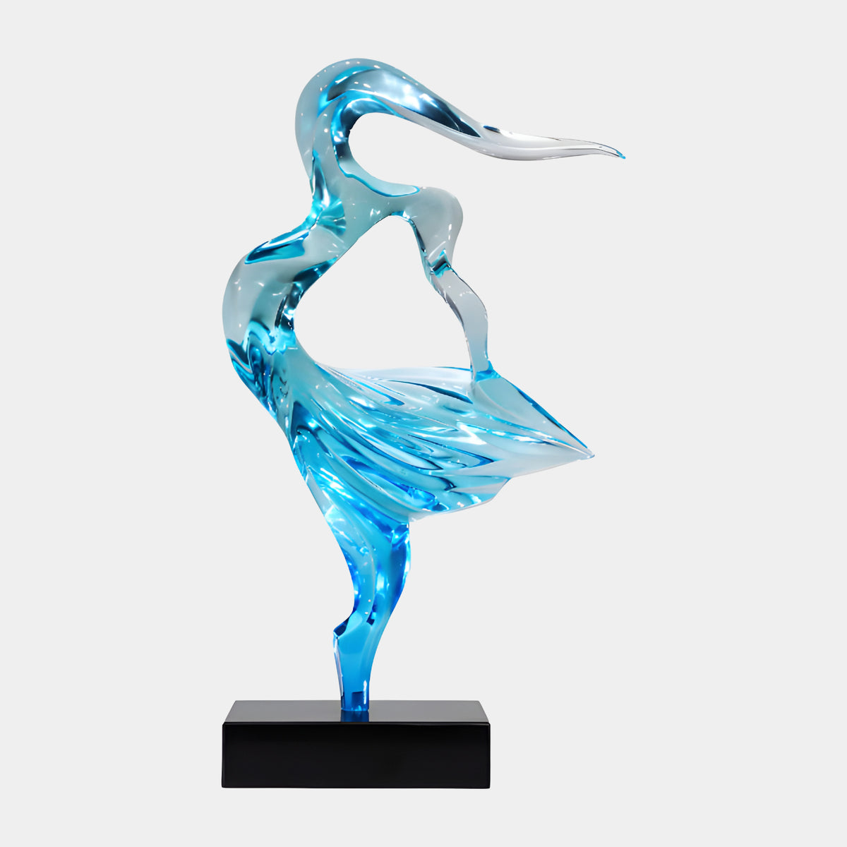 Blue Dancing Figure Resin Sculpture, 69cm, a bird-like dancer in translucent blue resin with a flaring skirt, on a black marble base, plain white background.