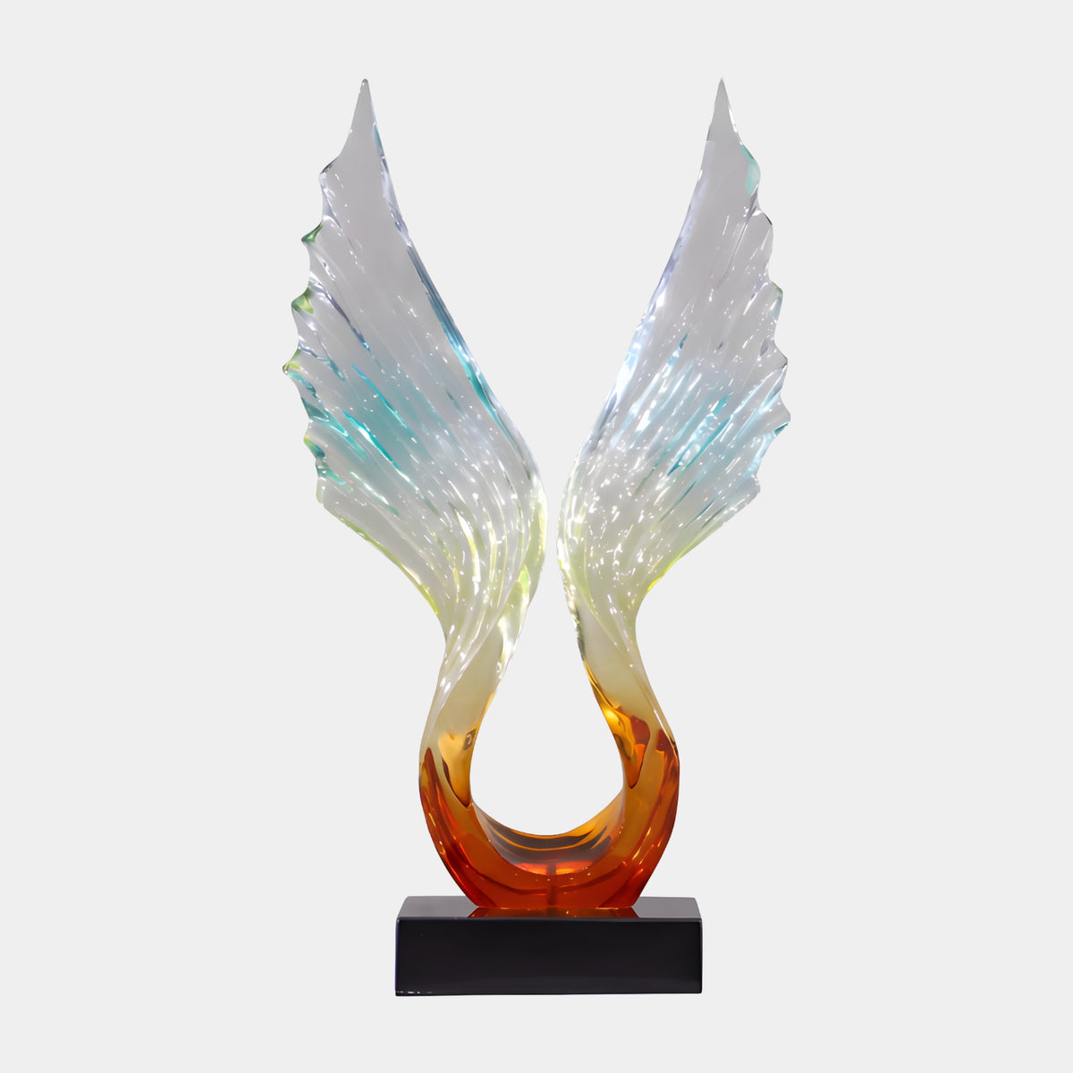 Amber to Clear Feathered Wings Resin Sculpture, 86cm, two ridged wings rising in a V from an amber base to clear tips, on a black marble block, plain white background.