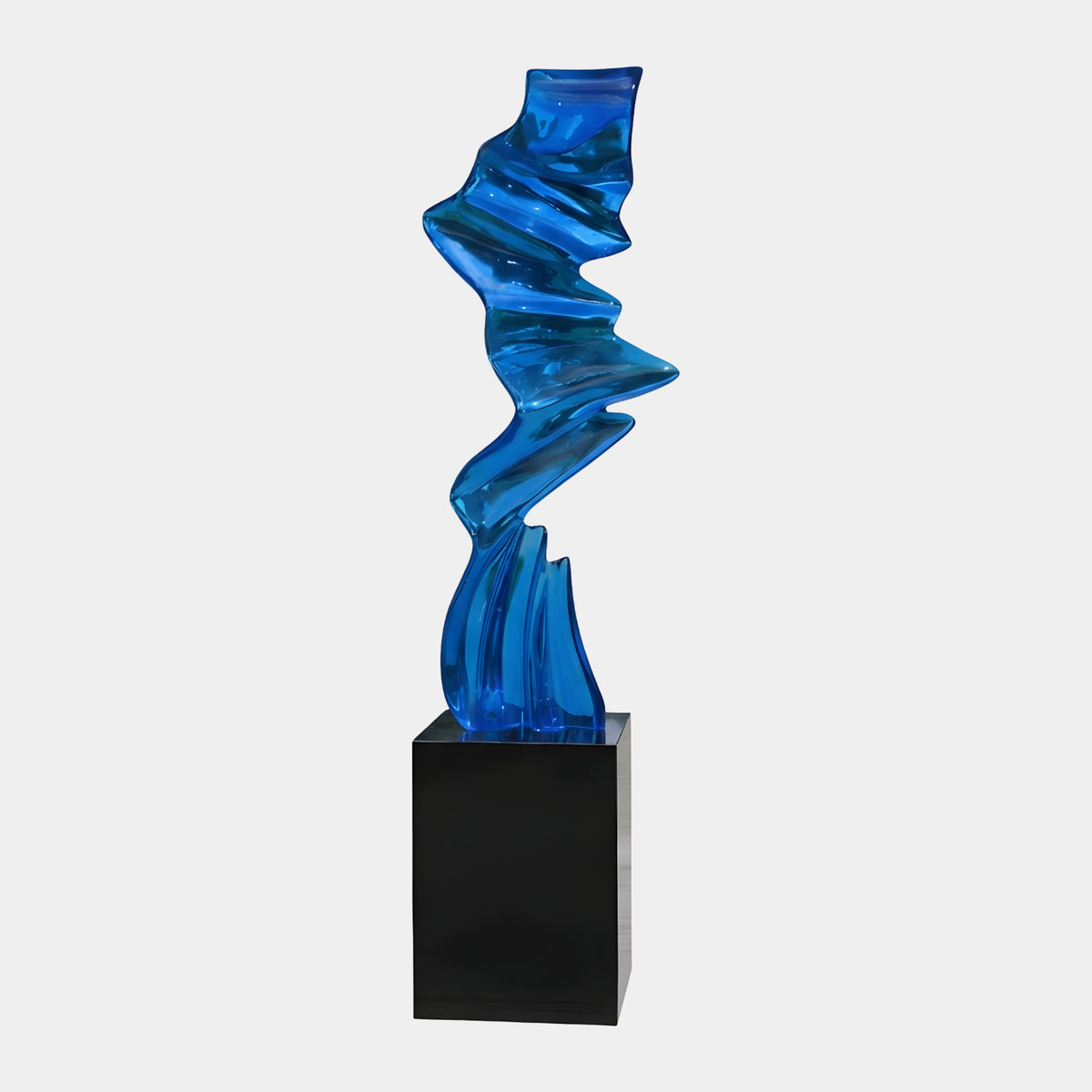 Clear Blue Folded Zigzag Column Resin Sculpture (216cm) by Giant Sculptures, a twisting blue ribbon-like form on a black marble plinth, set against a plain white background.