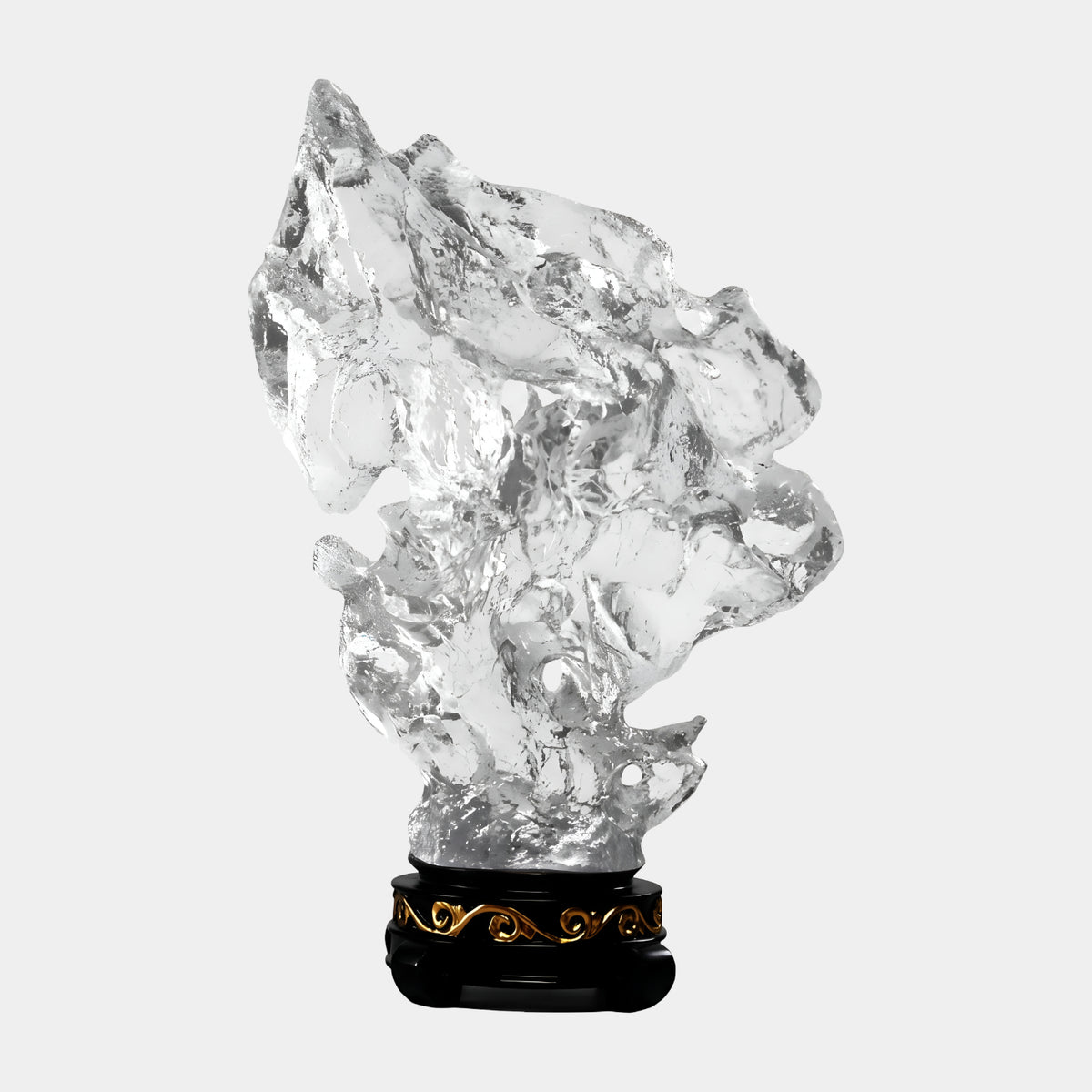 Clear Weathered Rock Resin Sculpture - 67cm by Giant Sculptures, a pierced colorless resin form with coarse texture on a dark carved stand with gilded scrollwork, set against a plain white background.