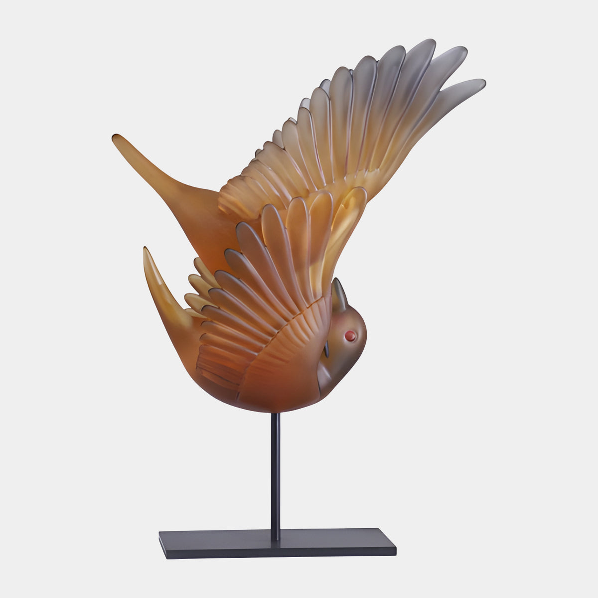 Amber Frosted Bird in Flight Resin Sculpture, 50cm, wings raised mid-flight on a black metal rod and plate stand, plain light grey background.