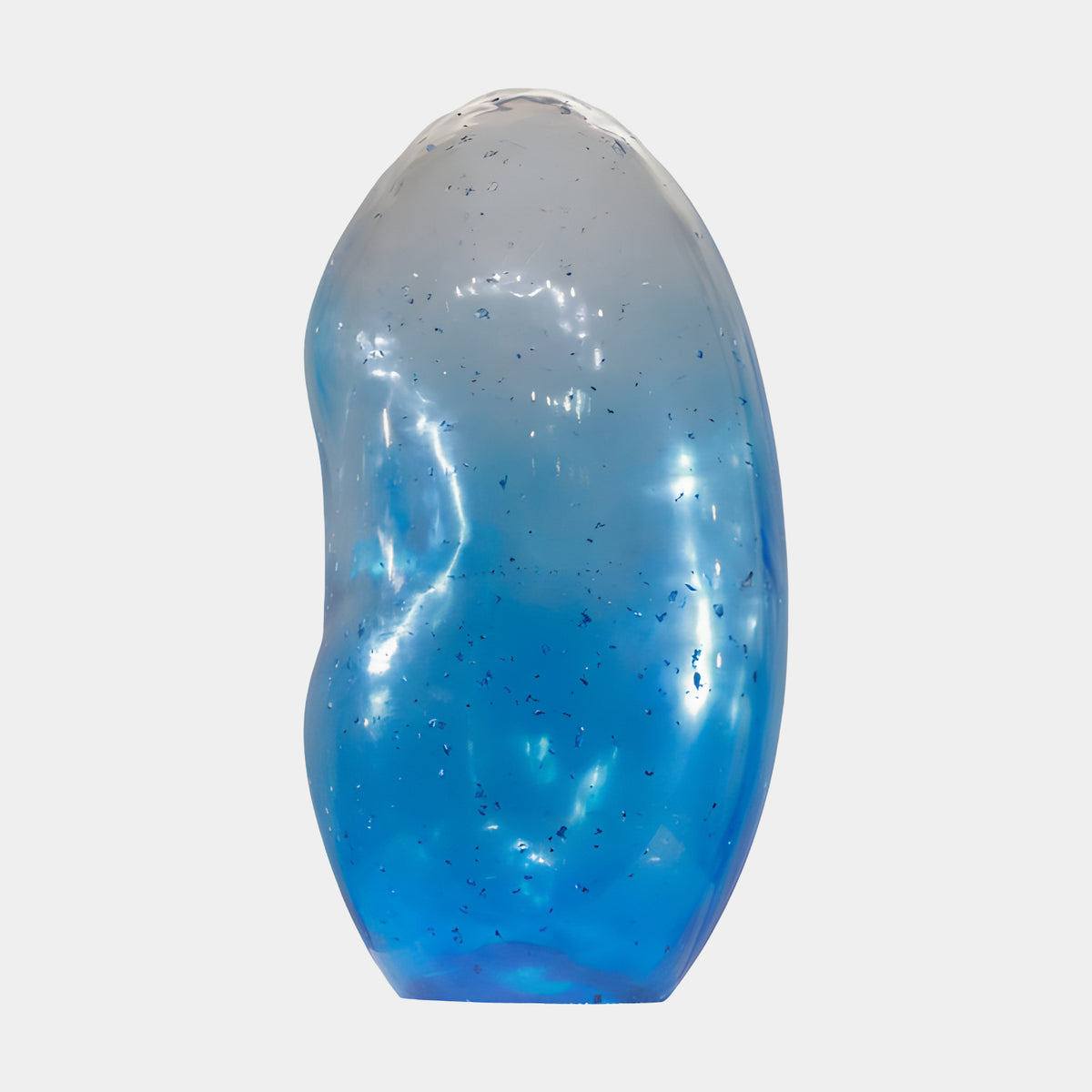 Blue Hollow Ovoid Resin Sculpture - 100cm, a smooth pebble-like form fading from clear at the crown to deep blue at the foot with suspended flecks, on a plain white background.