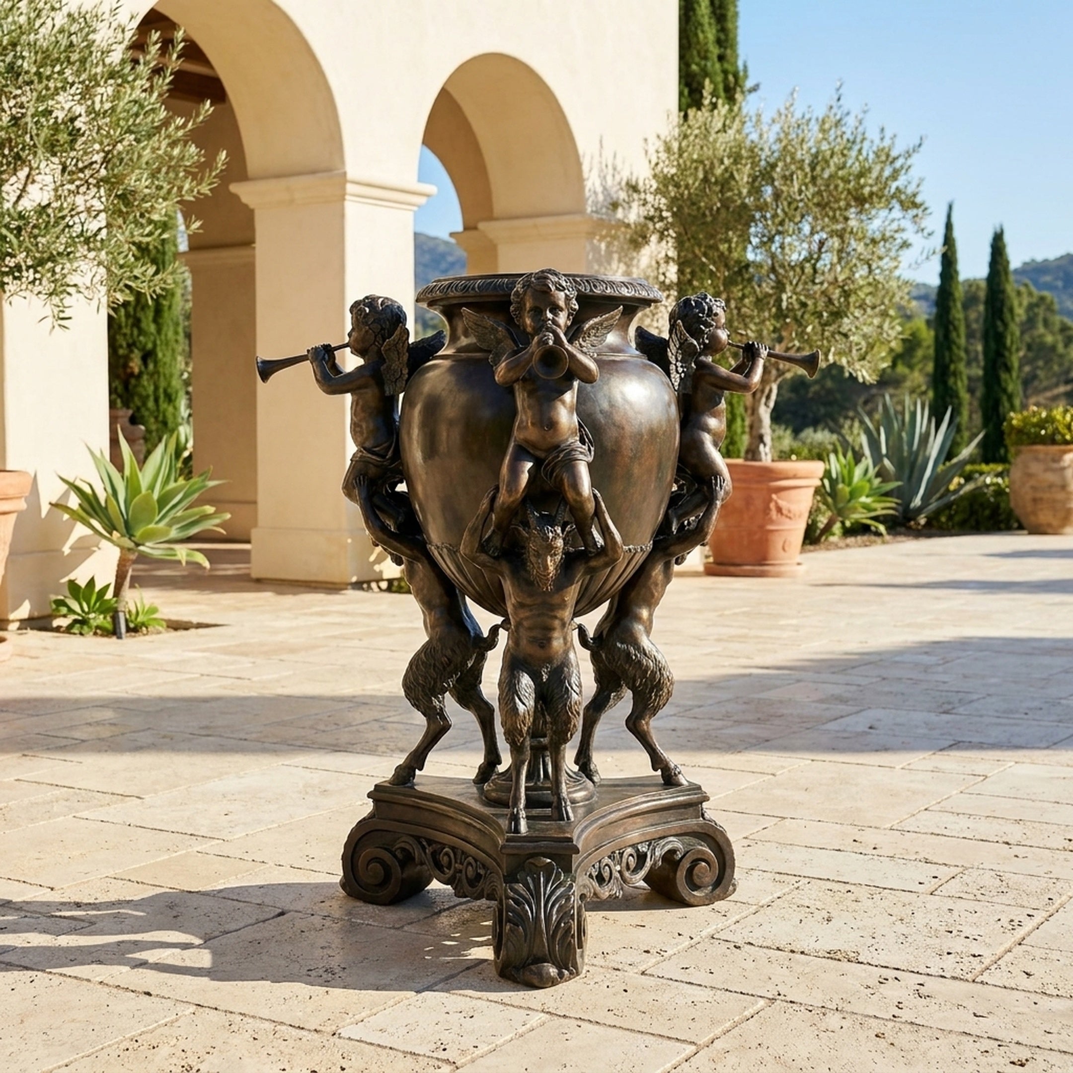 Classical Bronze Cherub Trumpet Urn Sculpture by Giant Sculptures on a stone courtyard, with winged cherubs and goat-legged fauns in antique bronze patina.