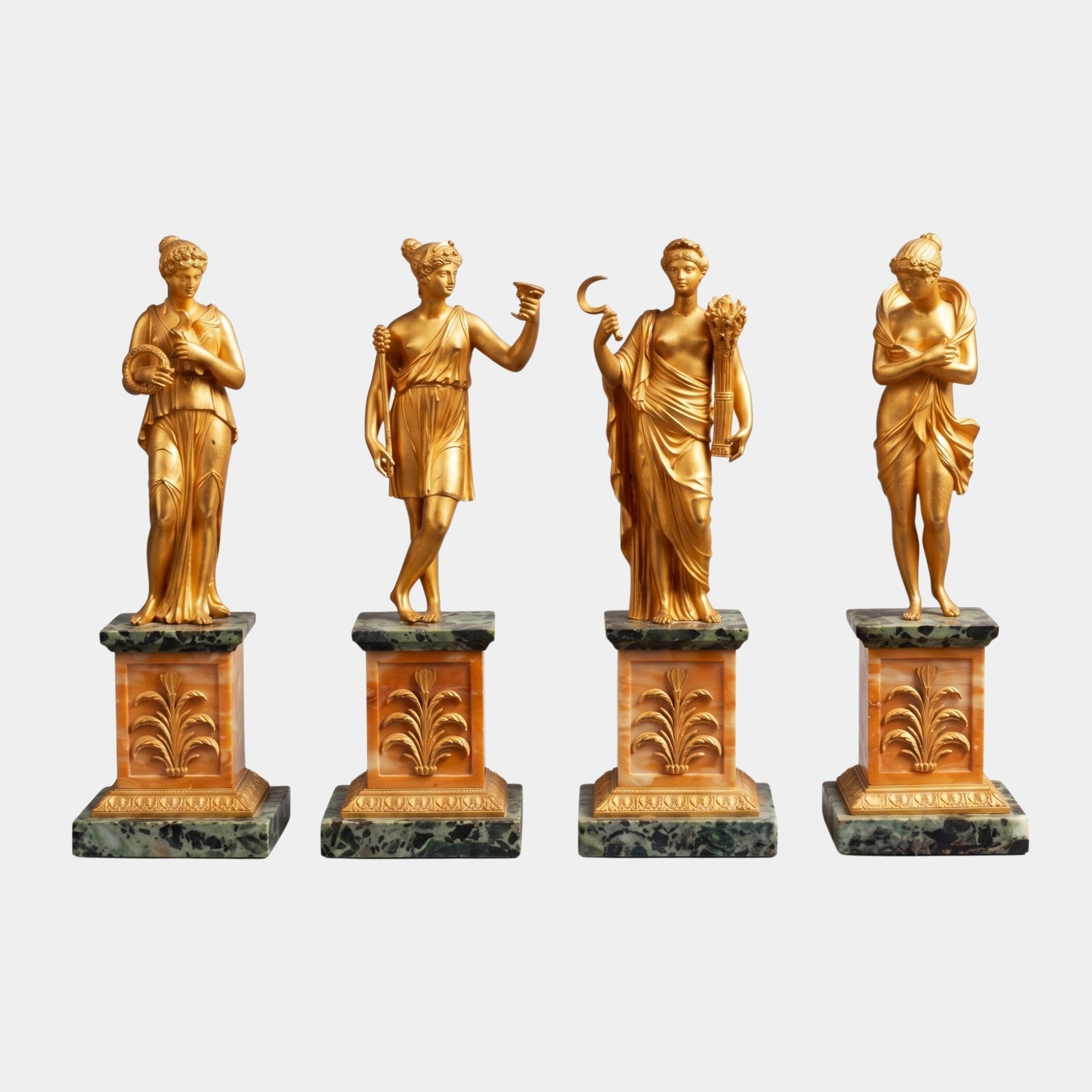 Classical Four Seasons Goddesses Bronze Sculpture Set by Giant Sculptures, four gilded figures on sienna and green marble plinths against a plain background.
