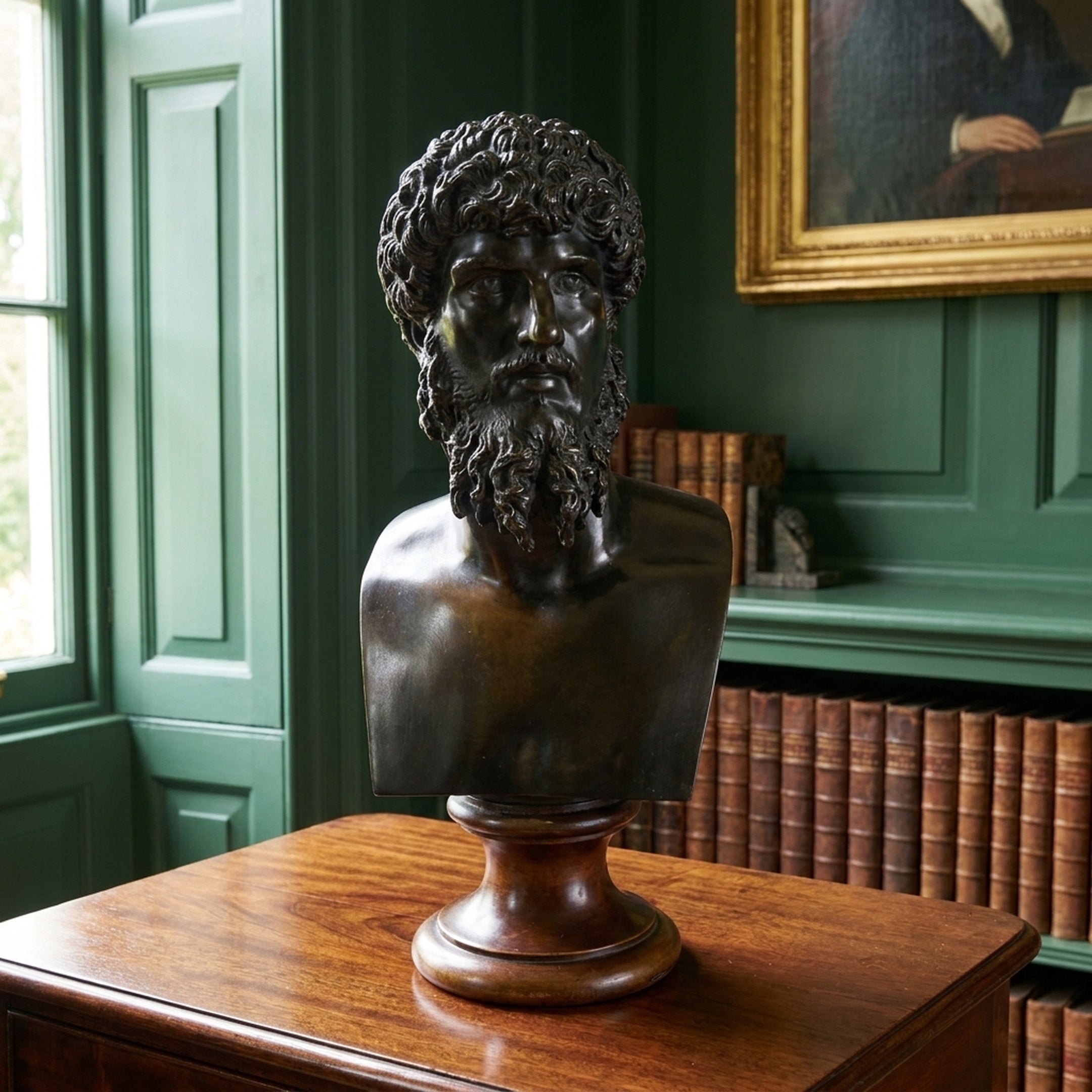 Classical Male Bust Bronze Sculpture by Giant Sculptures, 70cm, on a turned wooden pedestal atop a wooden cabinet in a green-panelled library.