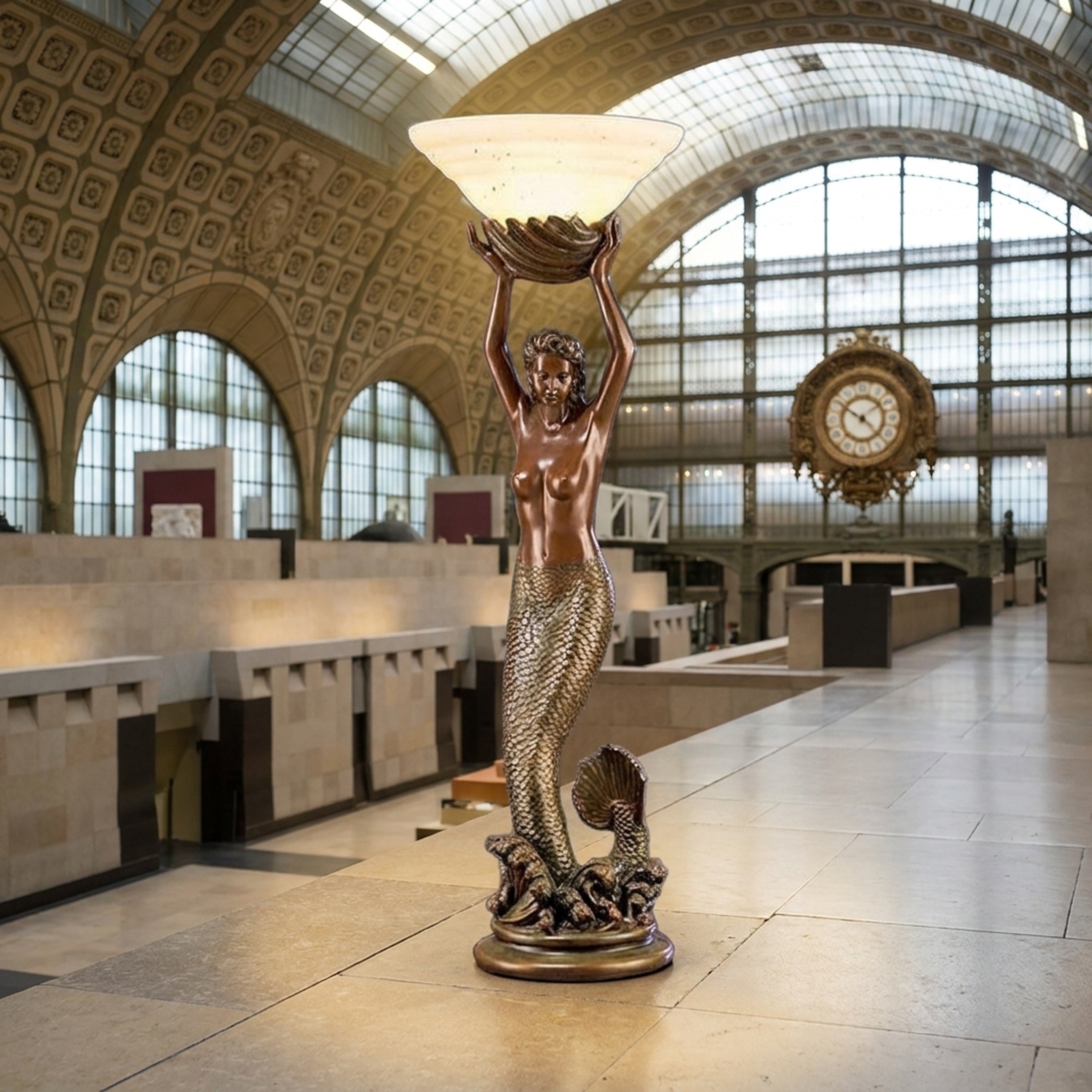 Classical Mermaid Floor Lamp Bronze Sculpture by Giant Sculptures, 120cm figure with raised arms holding a shell shade, shown in a grand vaulted hall.