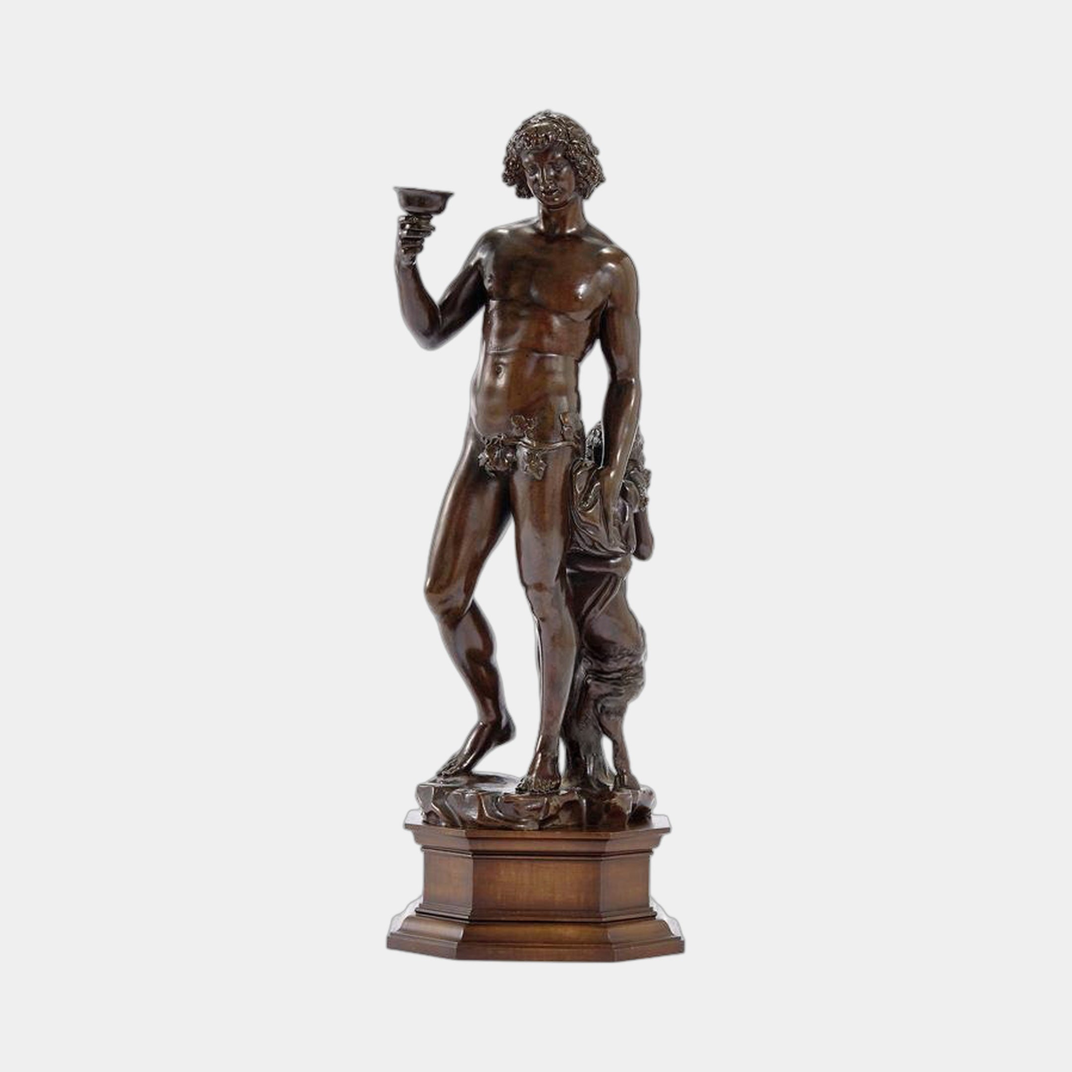 Classical Standing Bacchus Bronze Sculpture by Giant Sculptures, 100cm figure raising a chalice with warm brown patina on a stepped octagonal wood plinth.