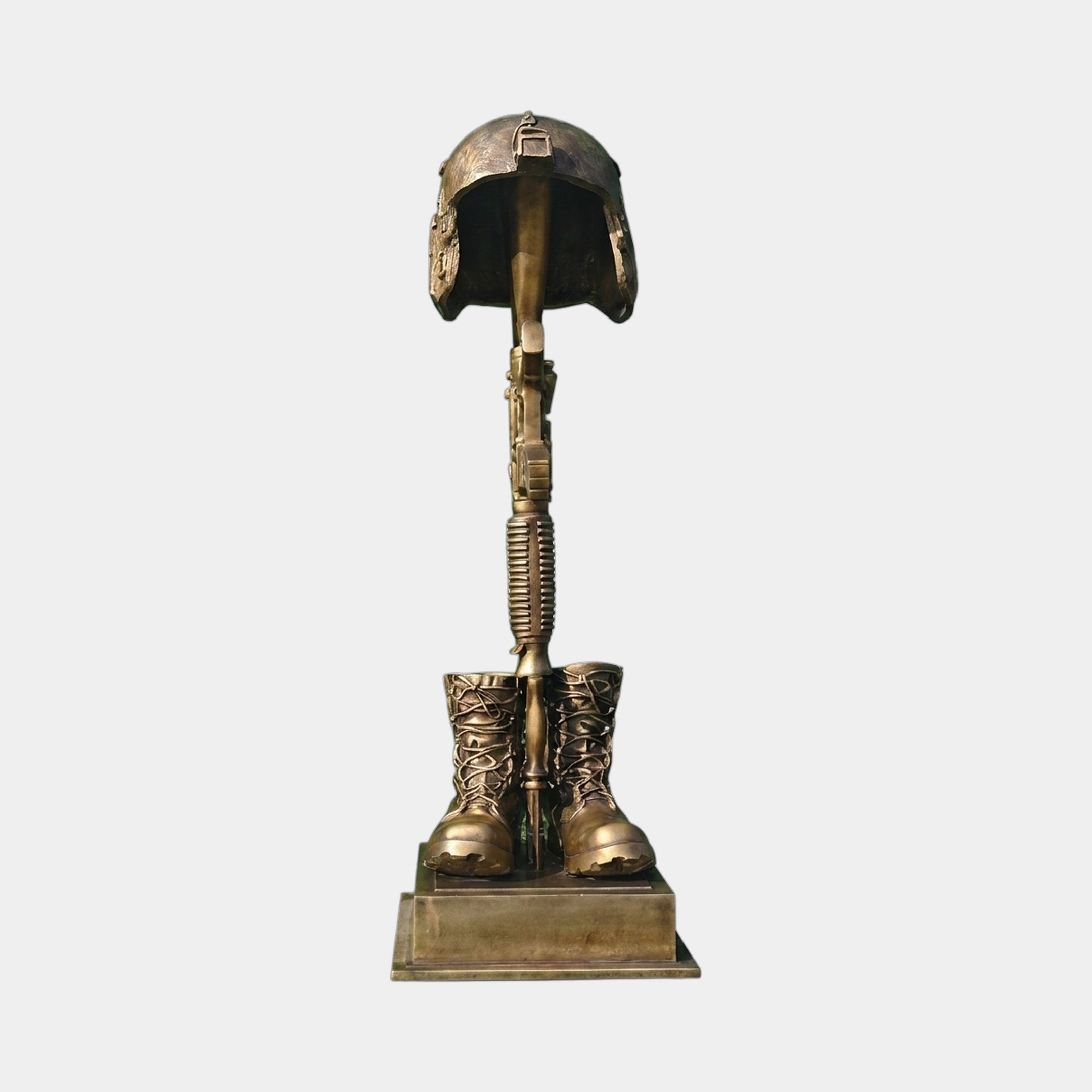 Contemporary Battle Cross Memorial Bronze Sculpture by Giant Sculptures, featuring a helmet atop an inverted rifle between laced combat boots on a stepped plinth.