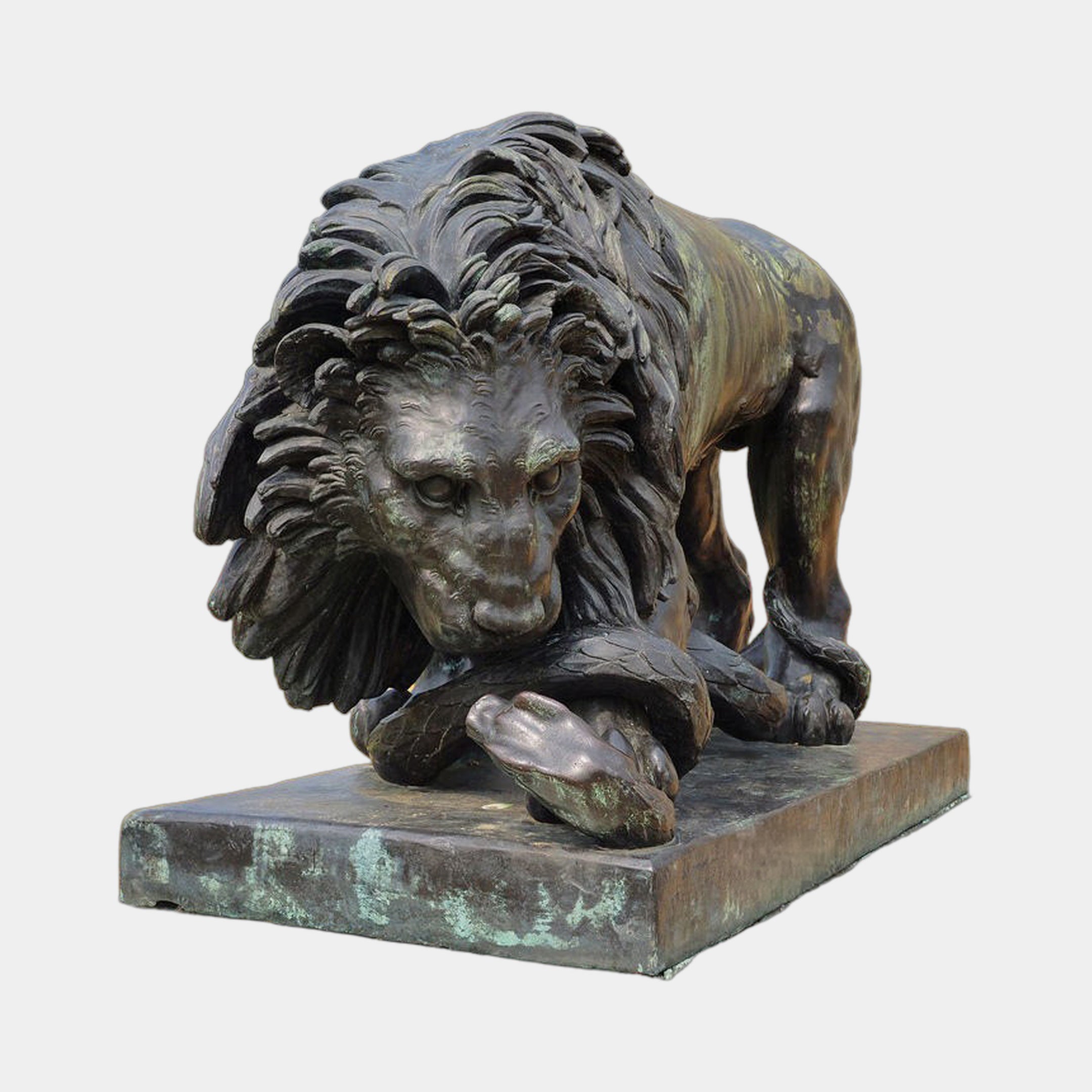 Large Classical Crouching Lion Bronze Sculpture by Giant Sculptures, shown in a forward crouch with paw on a serpent, dark antique patina with verdigris.