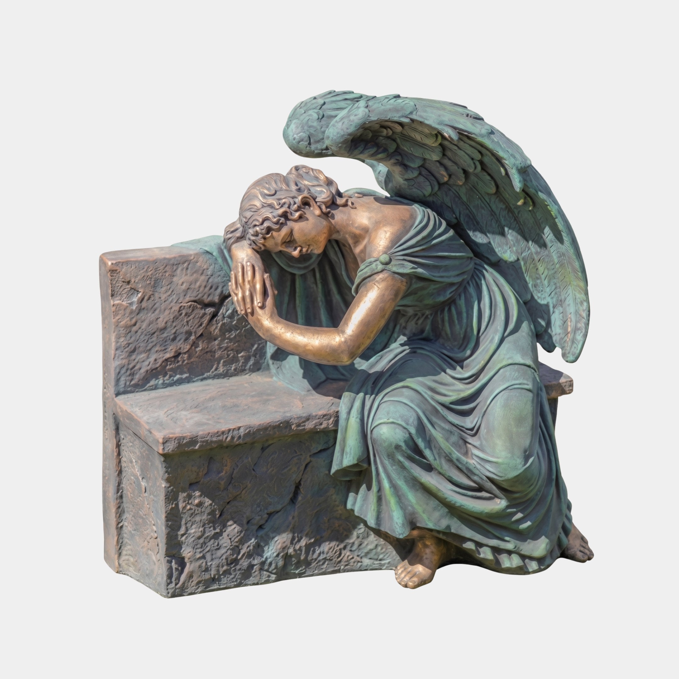 Large Classical Kneeling Angel Bronze Sculpture by Giant Sculptures, verdigris and bronze winged figure resting head on folded arms against a stone bench.