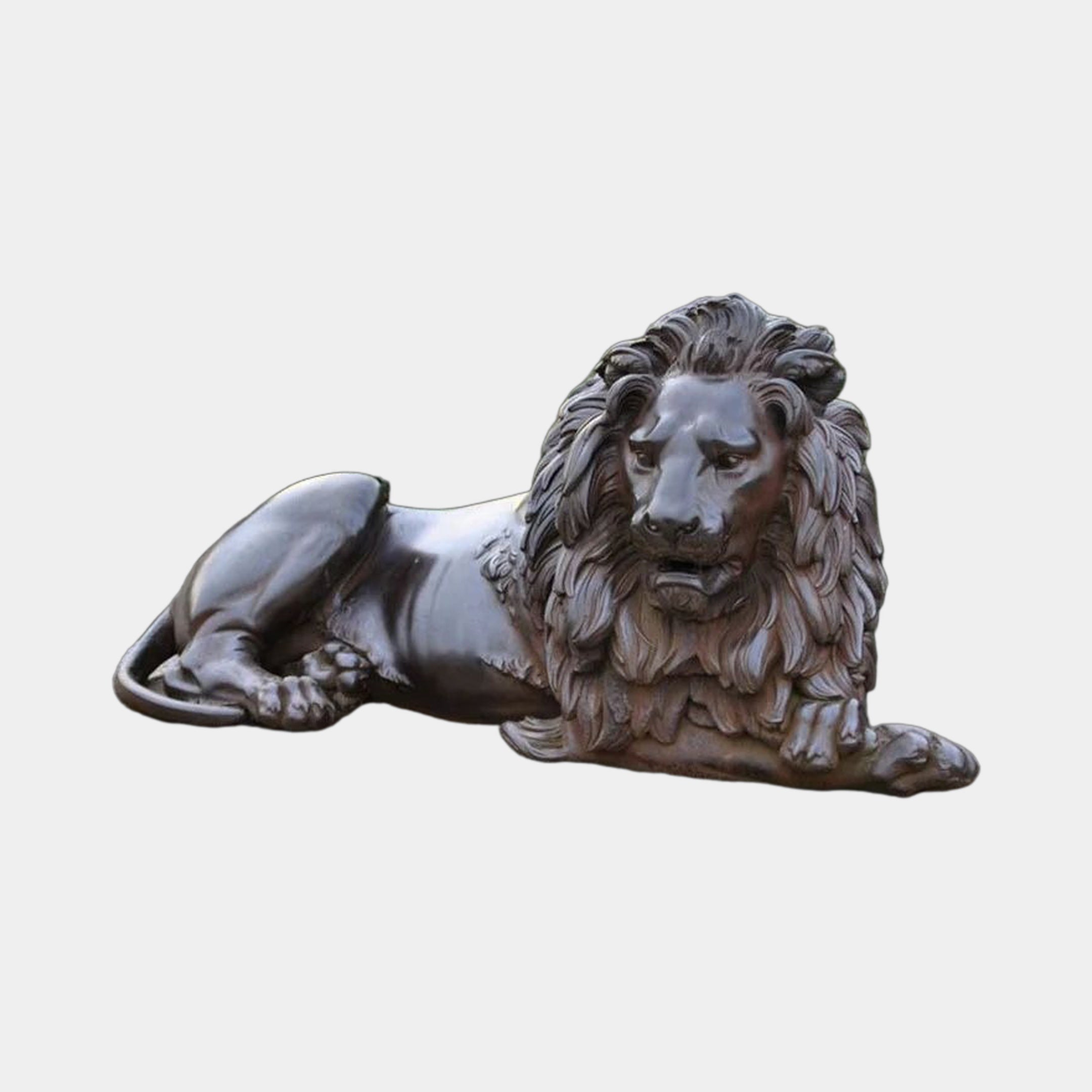 Large Classical Recumbent Lion Bronze Sculpture by Giant Sculptures, shown in side view with full mane and dark patina finish against a plain light grey background.