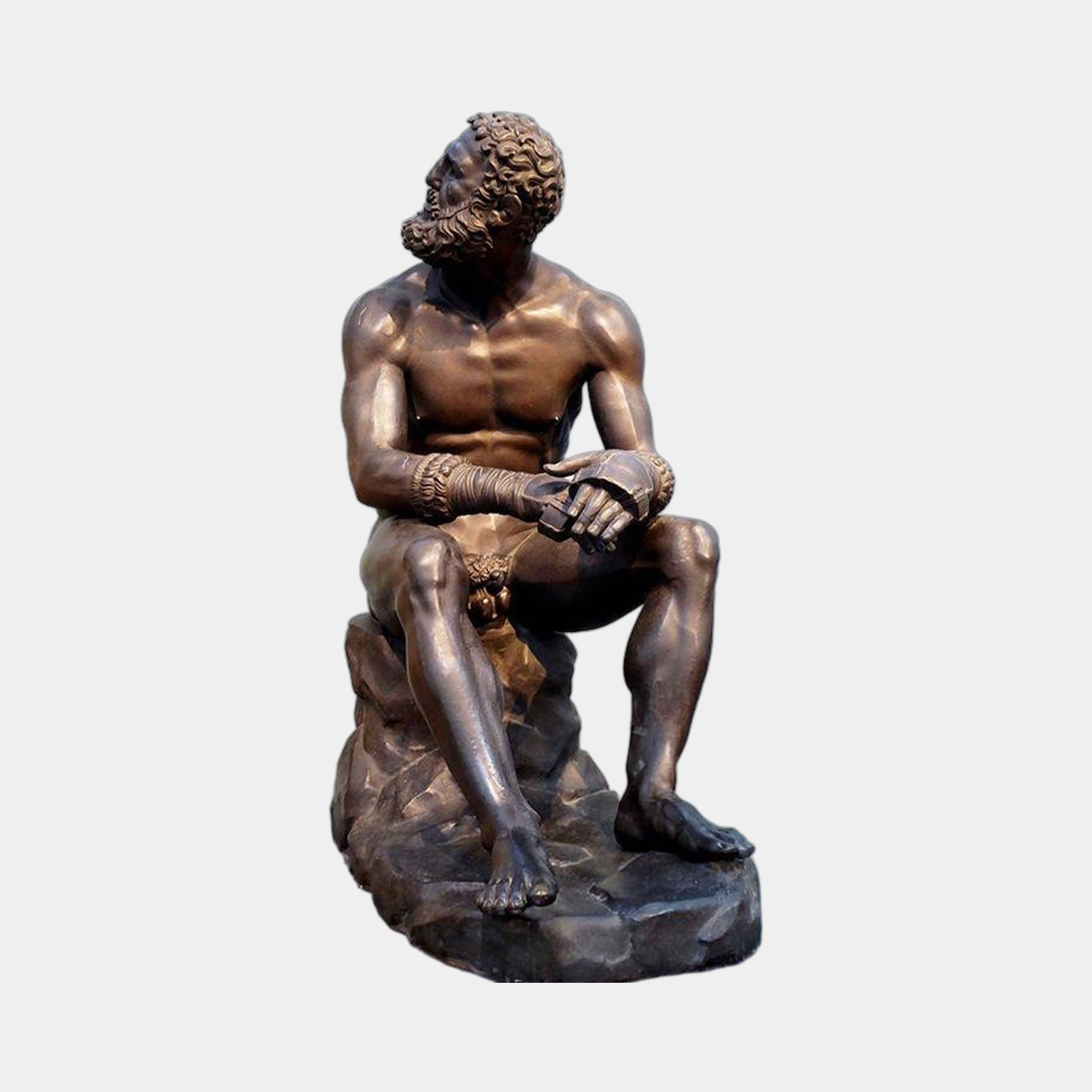 Giant Sculptures Large Classical Seated Boxer Bronze Sculpture, 130cm, bearded nude figure resting on a rocky base with caestus-wrapped hands, dark brown patina.