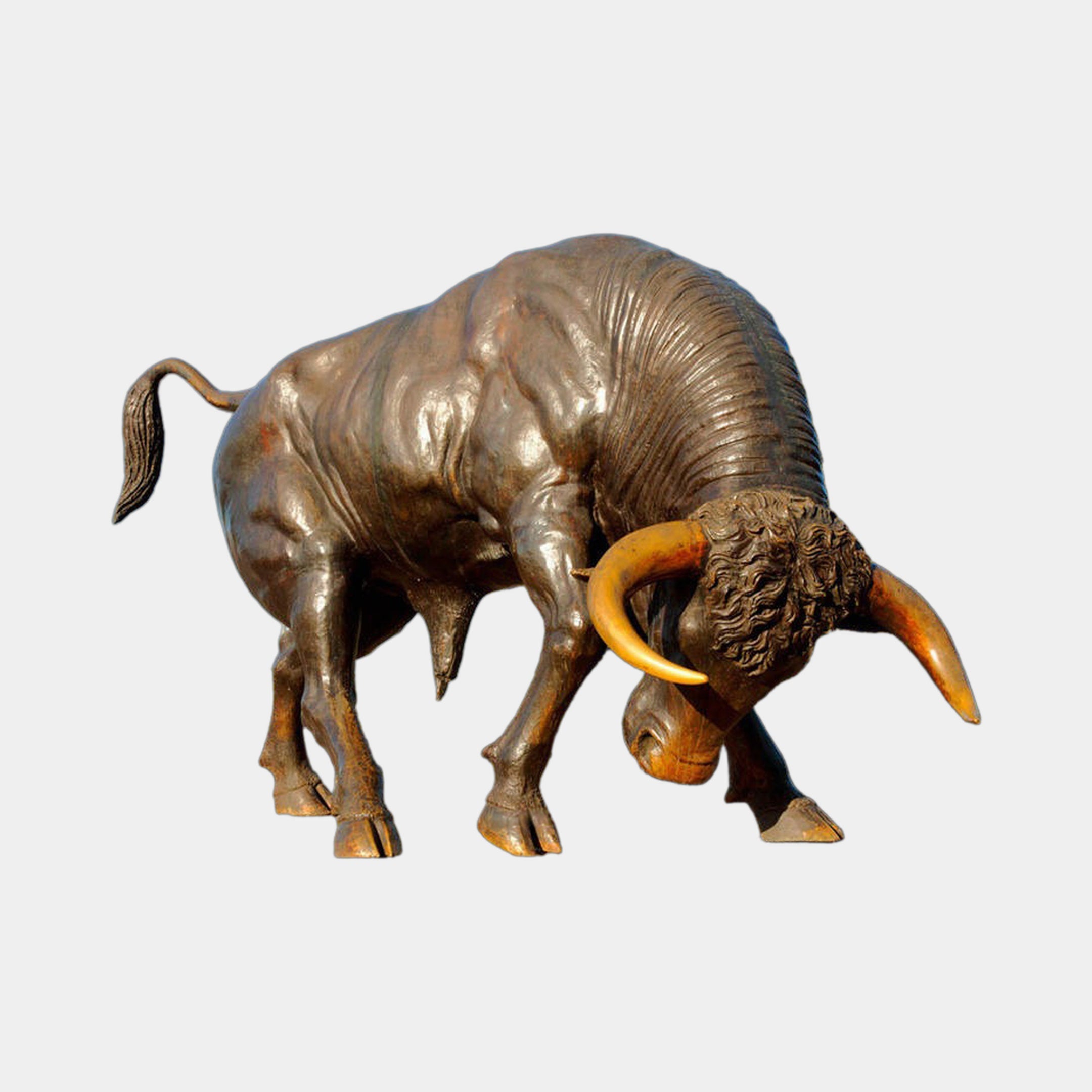 Large Contemporary Charging Bull Bronze Sculpture by Giant Sculptures, head lowered with golden-amber horns and dark brown patina, shown on a plain background.