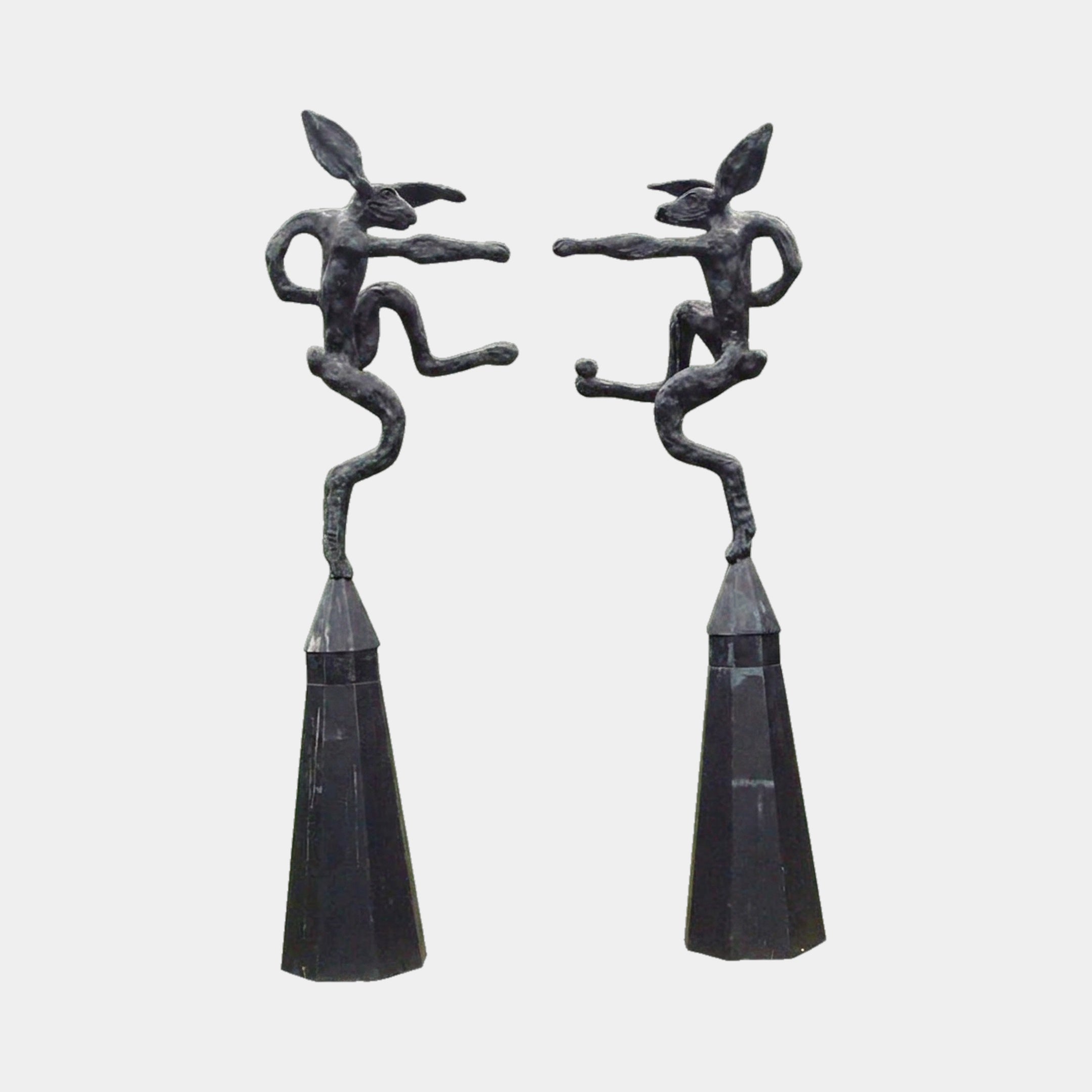Large Contemporary Fighting Hares Bronze Sculpture by Giant Sculptures, a 180cm pair of dark patinated hares boxing atop tapered obelisk plinths.