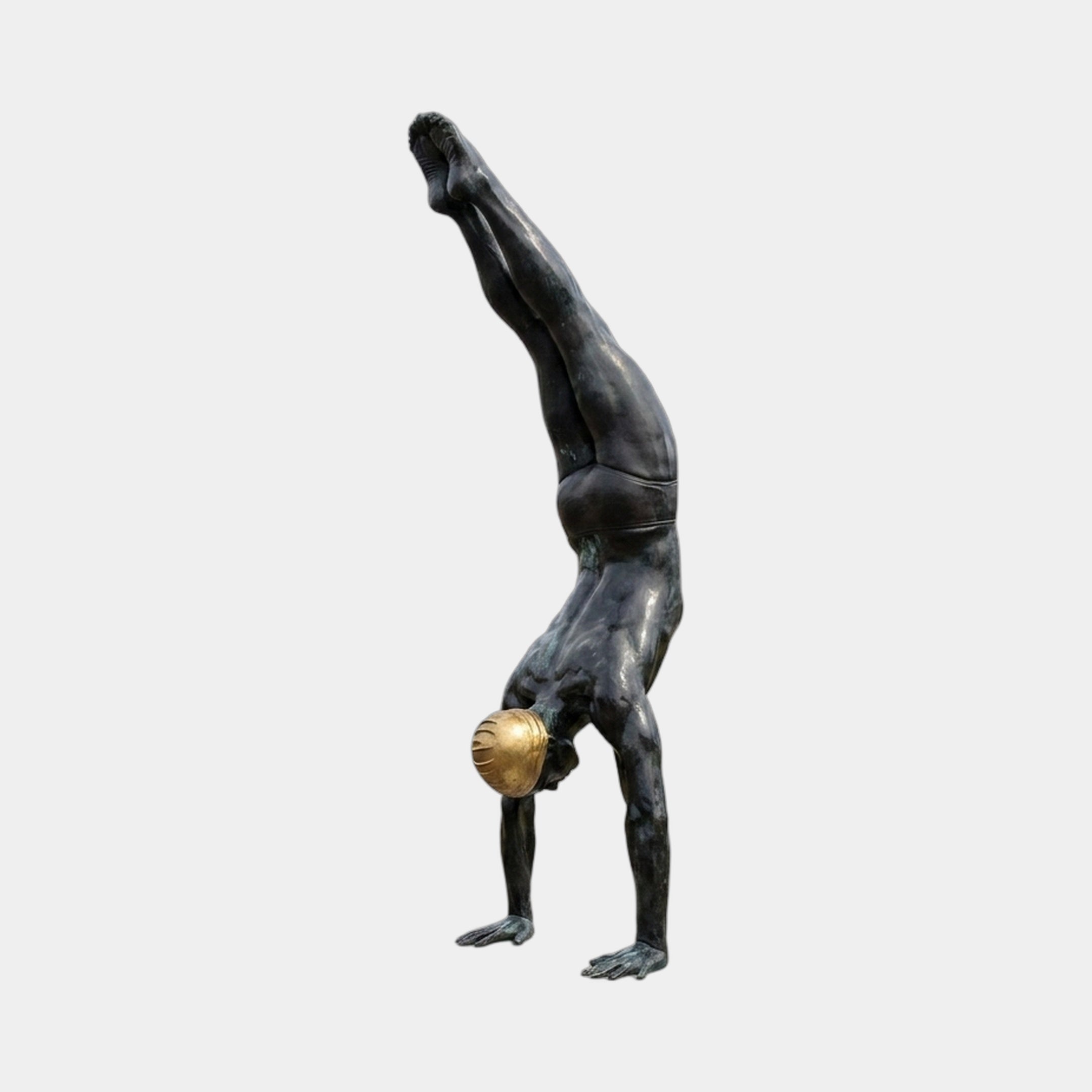 Large Contemporary Handstanding Male Figure Bronze Sculpture by Giant Sculptures, 240cm, dark patina, polished gold sphere between thighs, plain background.