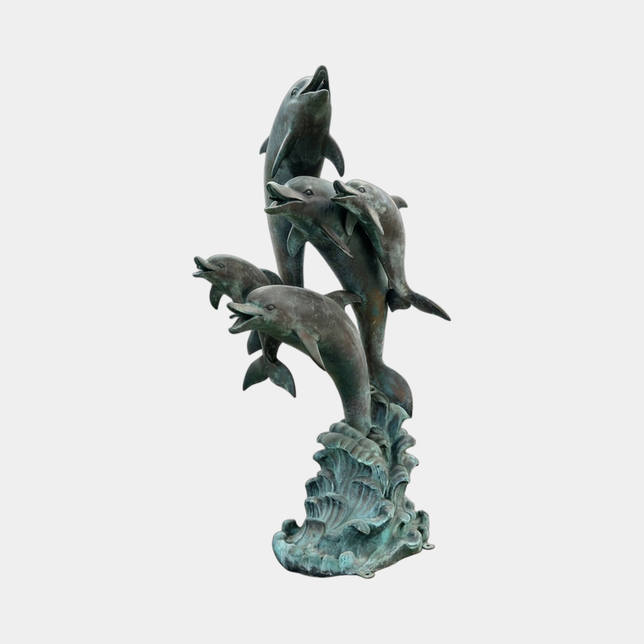 Large Contemporary Leaping Dolphins Bronze Sculpture by Giant Sculptures, five dolphins rising from a wave base in verdigris patina on a plain background.
