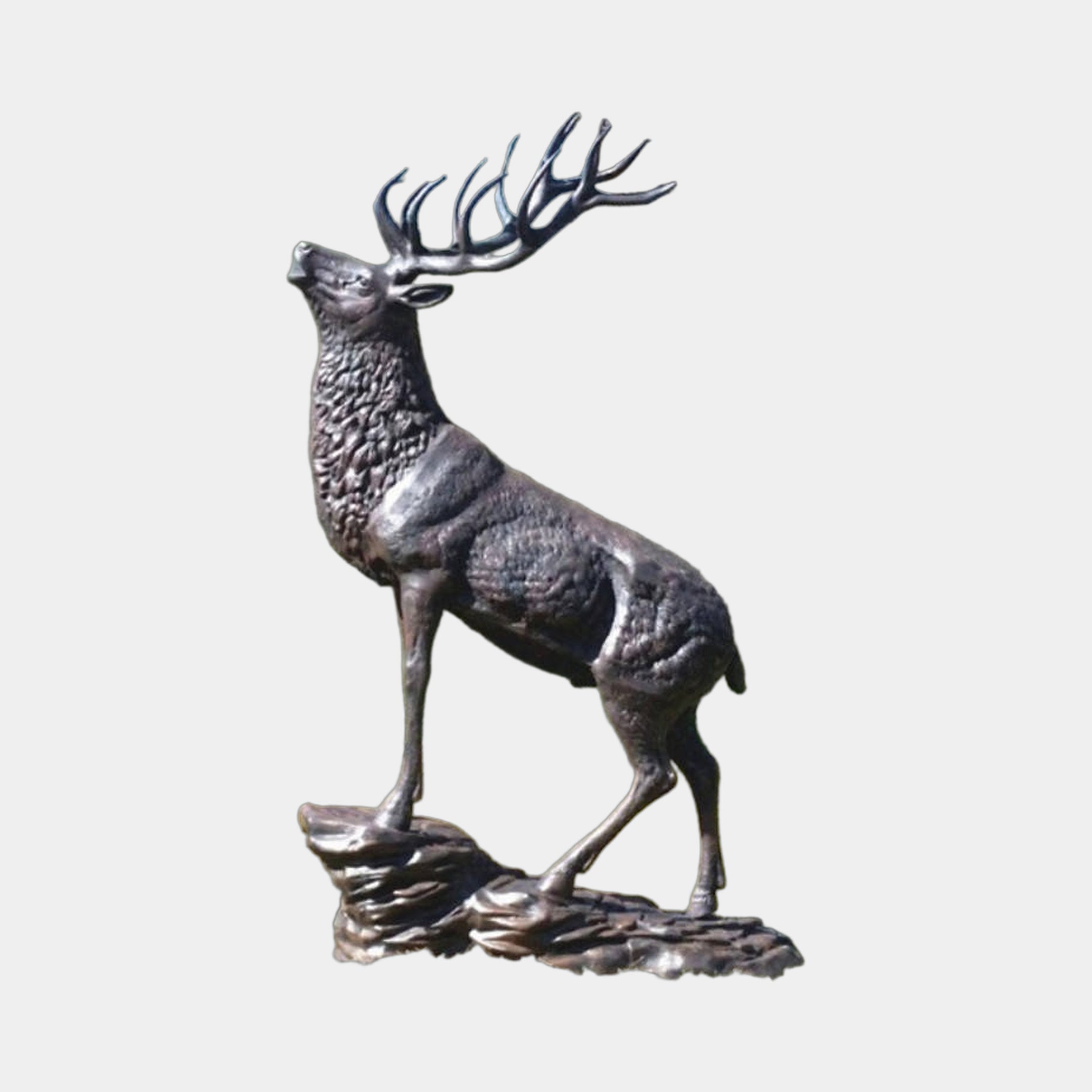 Large Traditional Rearing Stag Bronze Sculpture by Giant Sculptures, dark patina stag with raised head and full antlers on a rocky base, plain light background.