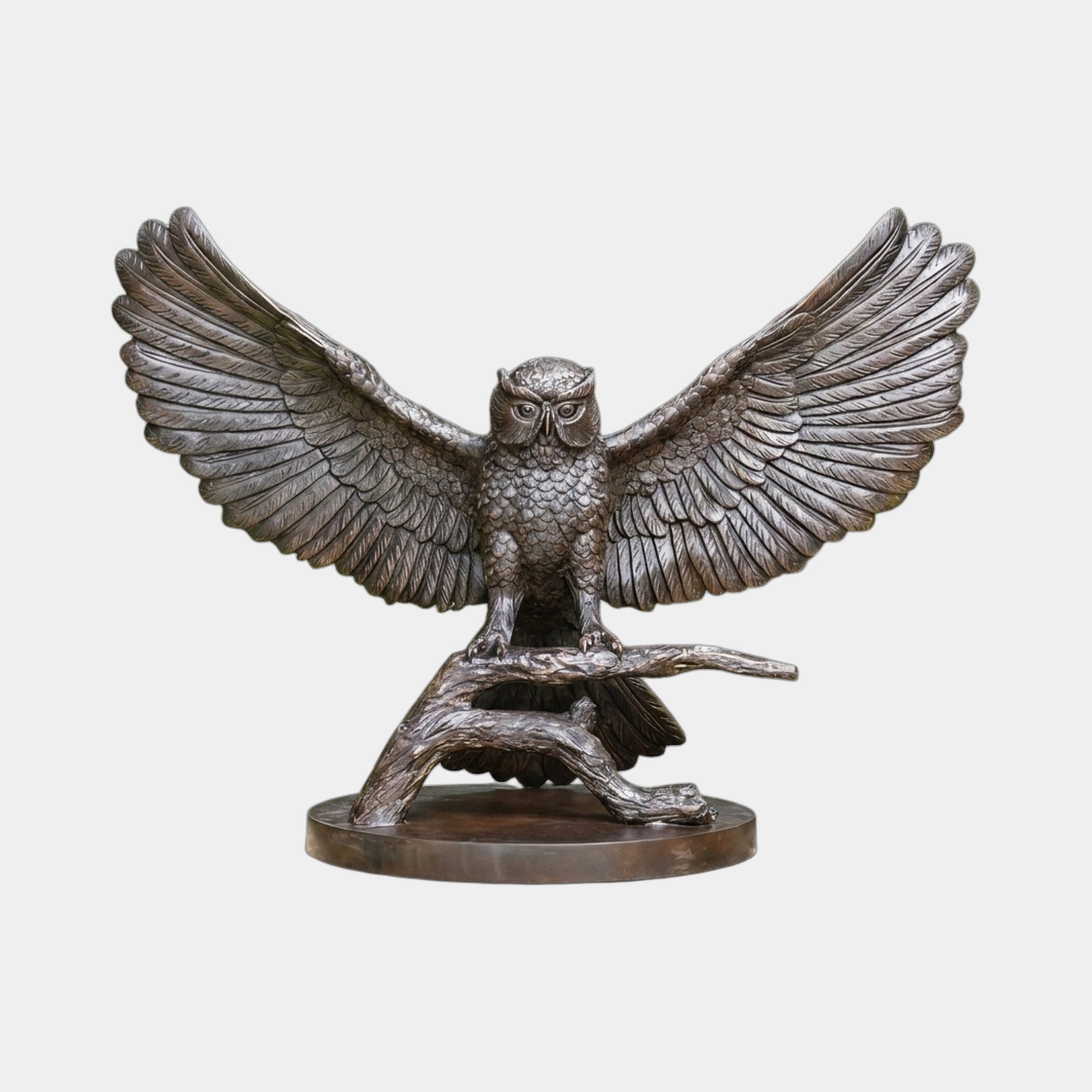 Large Traditional Spread-Wing Owl Bronze Sculpture by Giant Sculptures, front view with wings fully extended, perched on a branch atop a circular base.