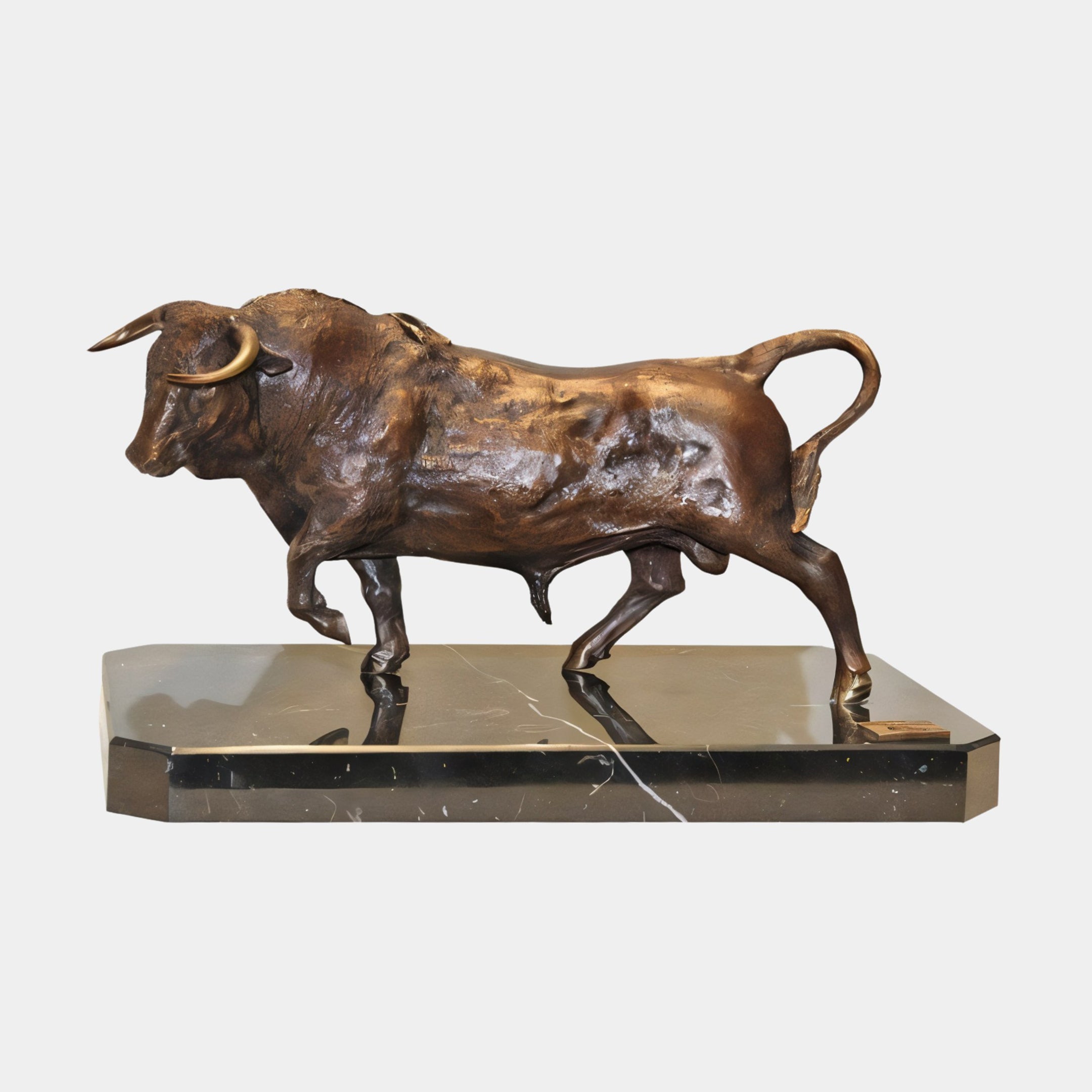 Large Traditional Striding Bull Bronze Sculpture by Giant Sculptures shown in side profile on a bevelled black marble base against a plain light background.