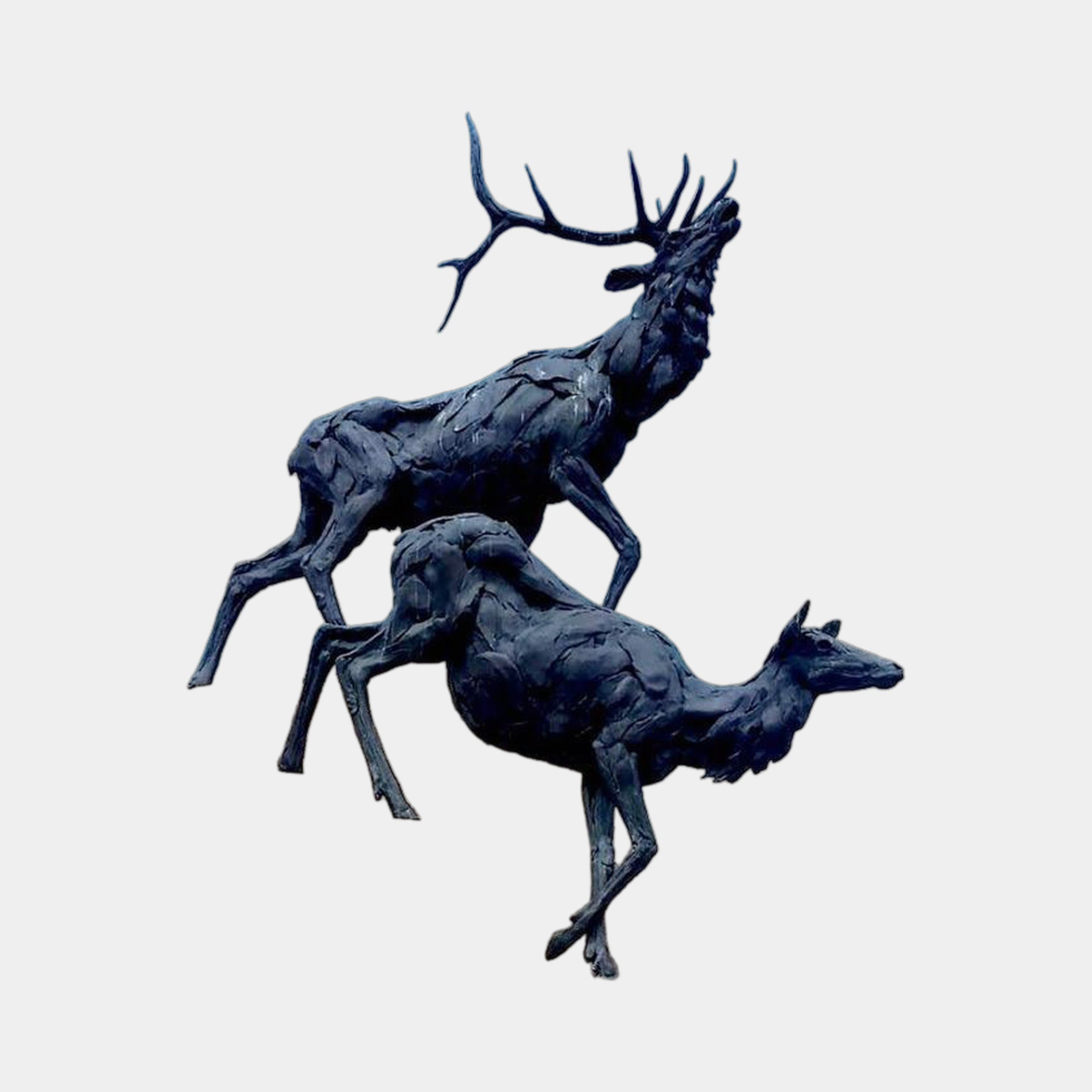 Life-Size Bugling Stag and Deer Bronze Sculpture by Giant Sculptures, showing the antlered stag bugling upward behind a leaping deer in dark patina finish.