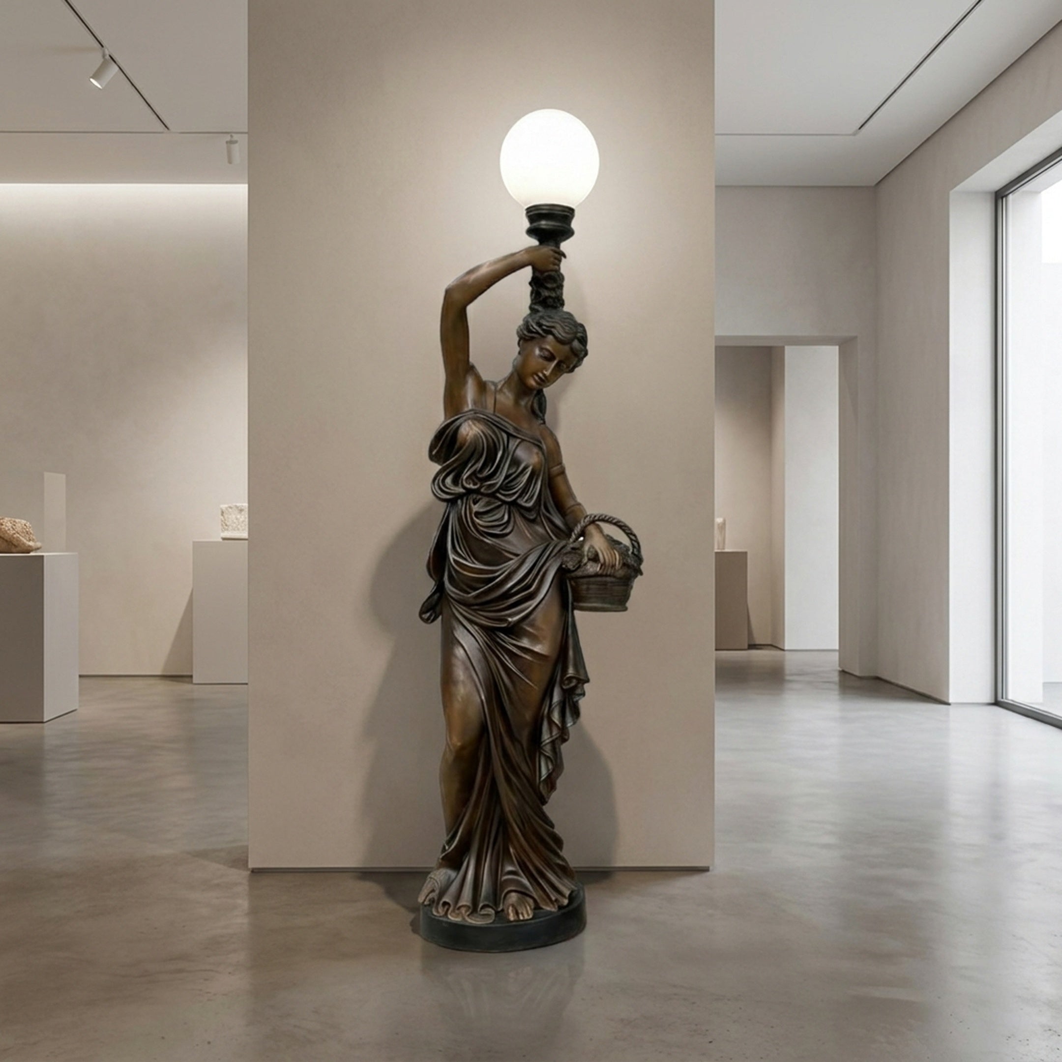Life-Size Classical Female Figure Bronze Sculpture by Giant Sculptures, 230cm draped goddess holding a frosted globe lamp aloft and a basket, in a gallery.