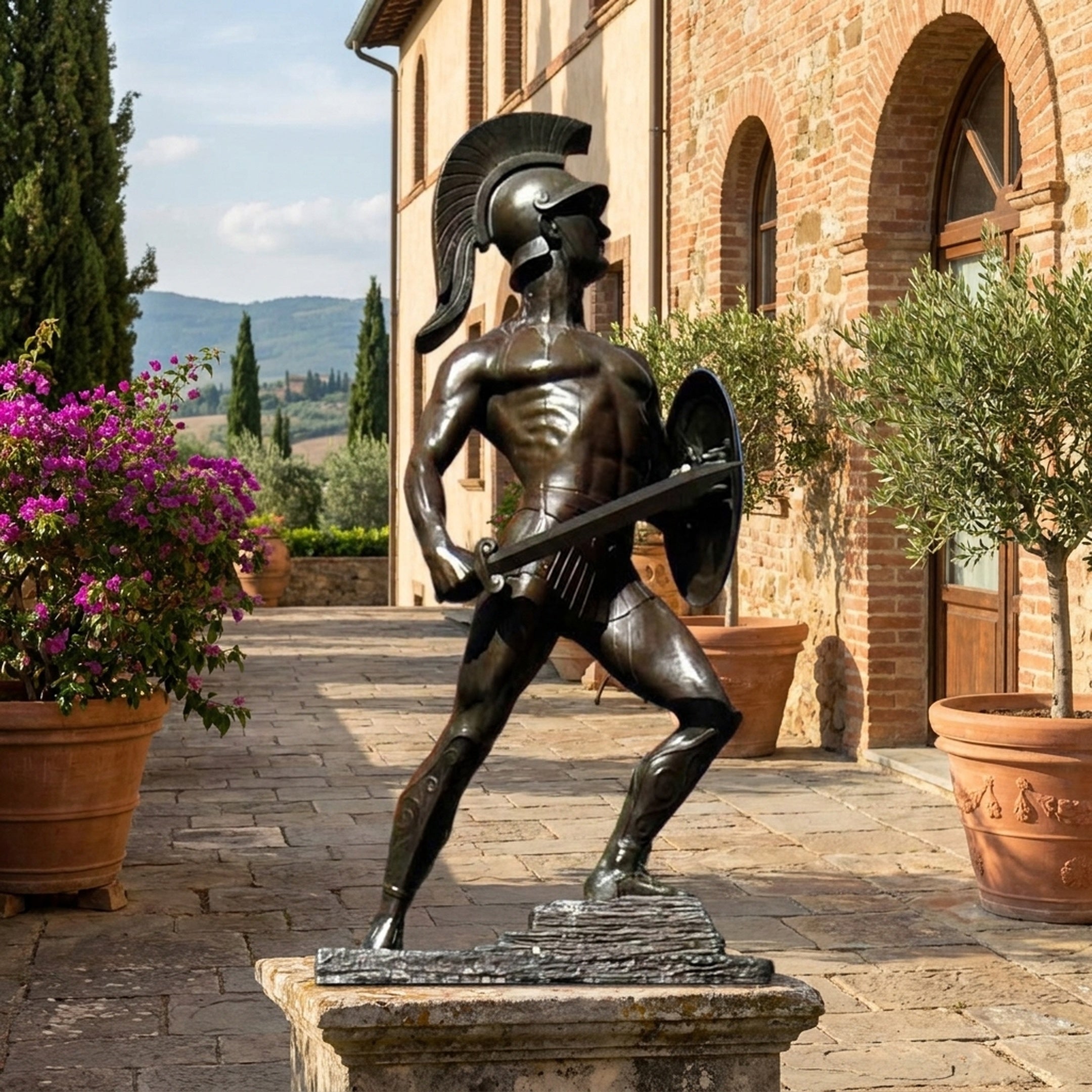 Life-Size Classical Greek Warrior Bronze Statue by Giant Sculptures in dark patina, sword and shield raised in combat stance, displayed on a Tuscan terrace.