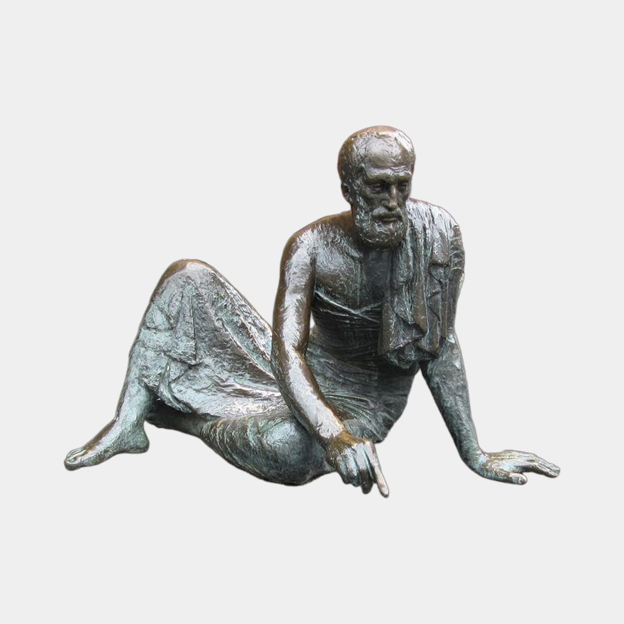 Life-Size Classical Reclining Bearded Scholar Bronze Sculpture by Giant Sculptures, seated figure in antique patina with green oxidation on a plain background.