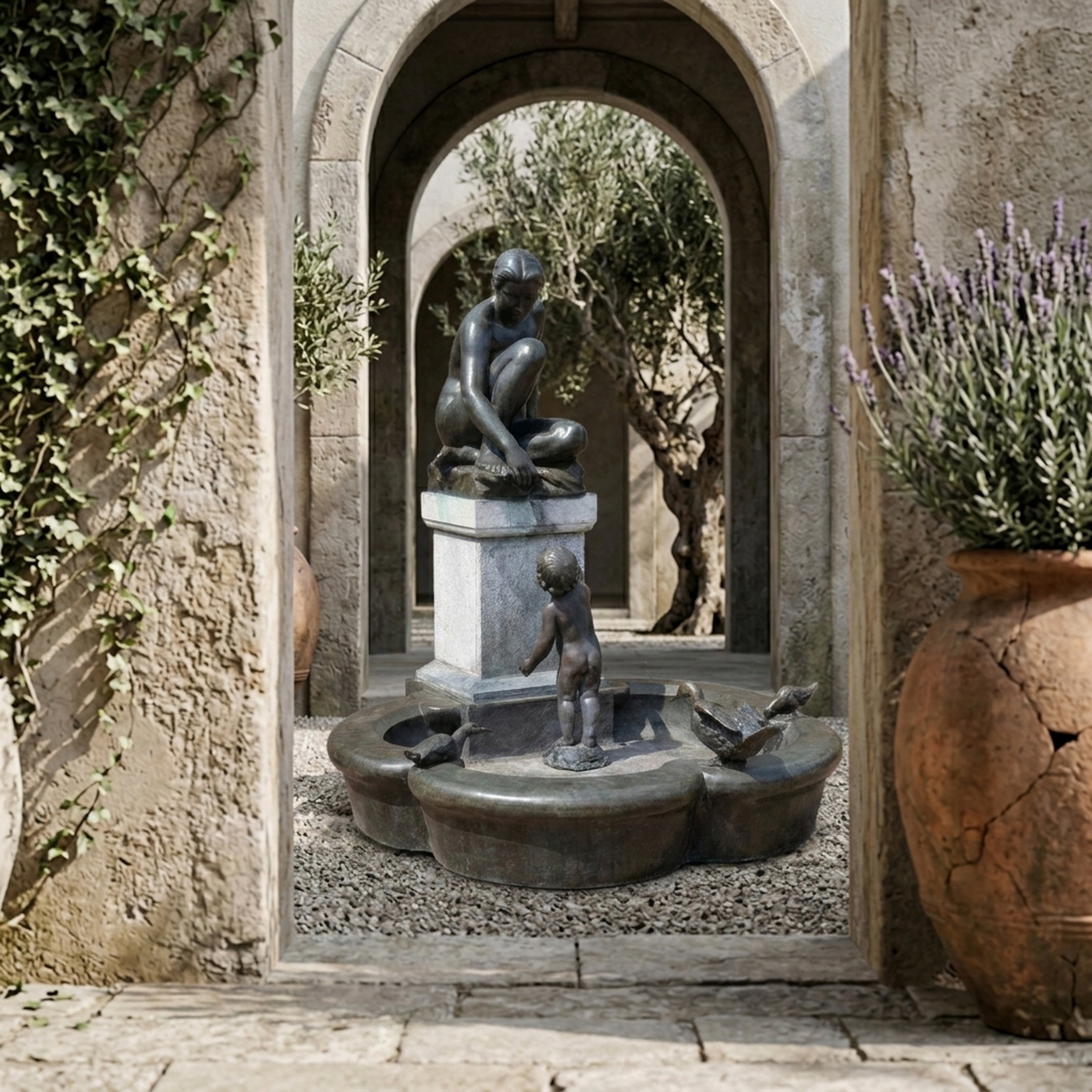 Life-Size Classical Seated Woman and Child Bronze Fountain by Giant Sculptures in a stone courtyard archway, framed by lavender, ivy, and olive trees.
