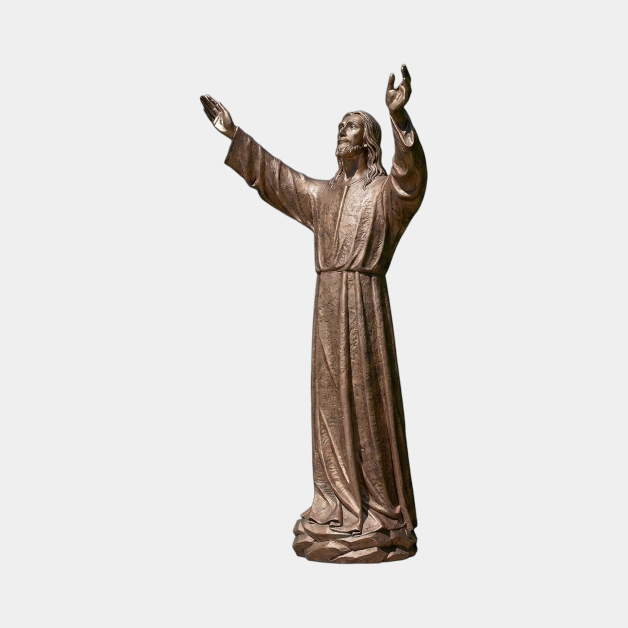 Life-Size Classical Standing Jesus Christ Bronze Sculpture by Giant Sculptures, 220cm figure with arms raised heavenward, golden-brown patina, on a stone base.