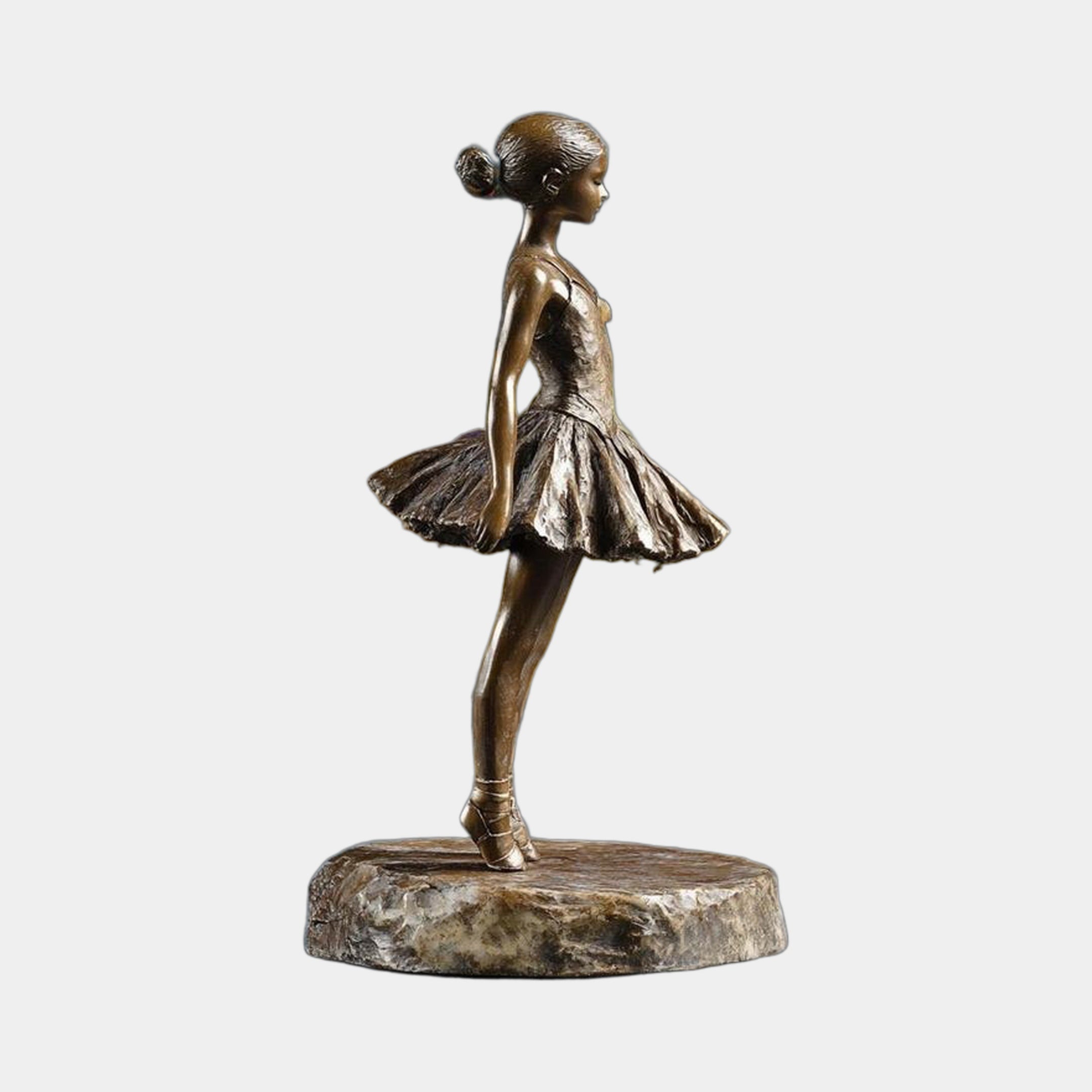 Life-Size Contemporary Ballerina Bronze Sculpture by Giant Sculptures, side profile of a young dancer on pointe in a layered tutu, on a natural stone base.