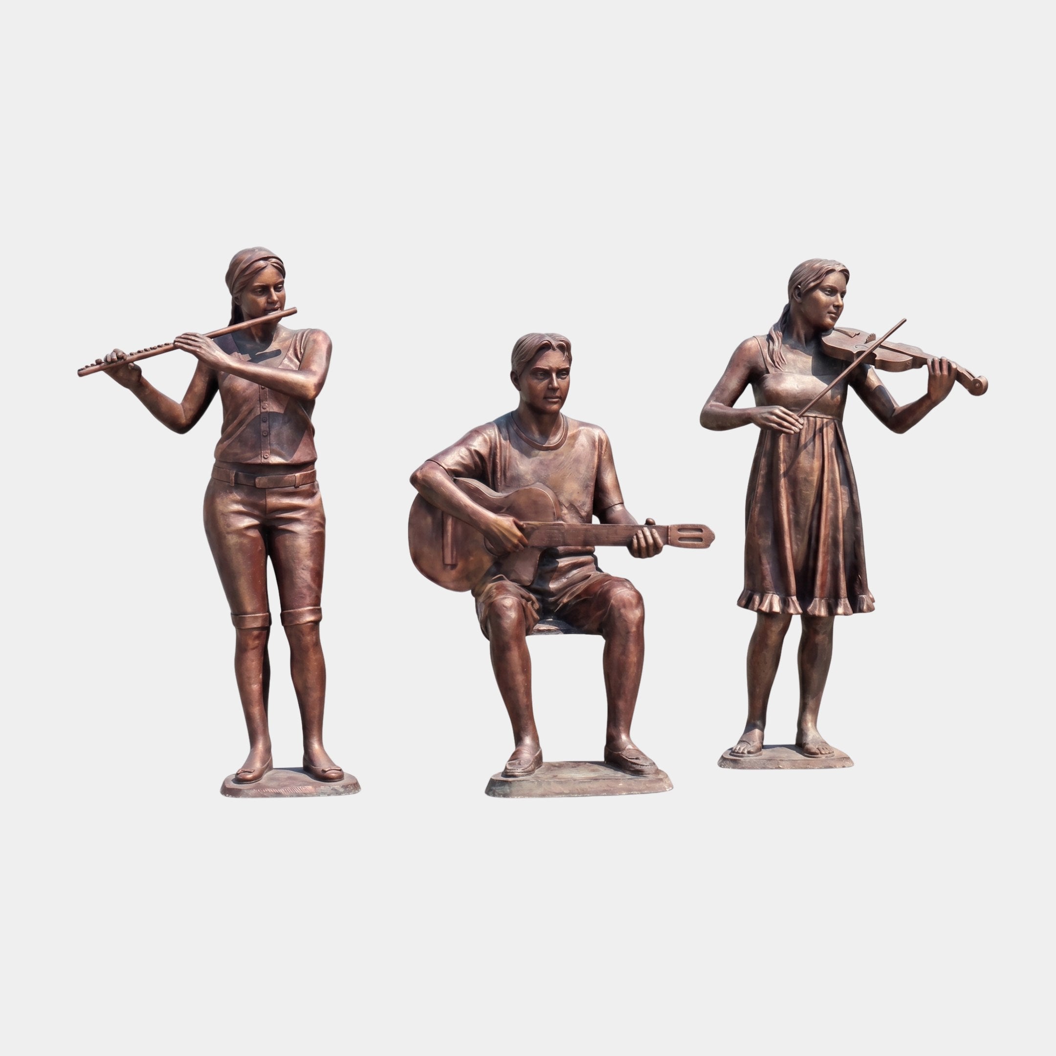 Life-Size Contemporary Musician Trio Bronze Sculpture by Giant Sculptures, 210cm, featuring a flutist, seated guitarist, and violinist in warm reddish-brown patina.