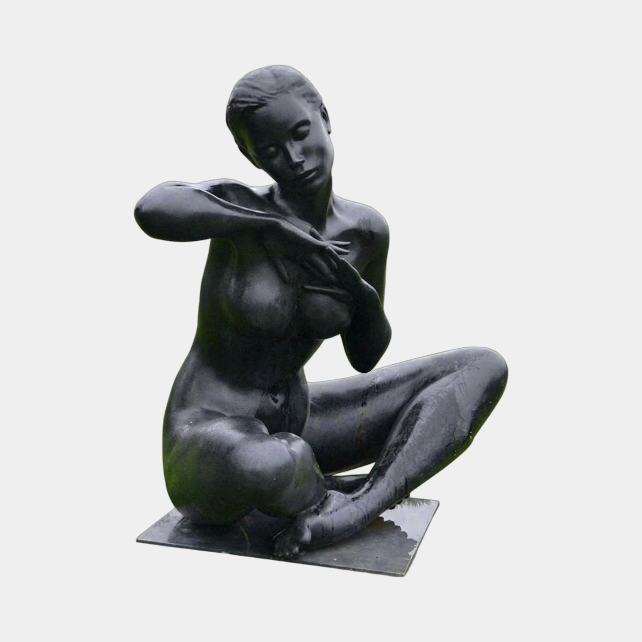 Life-Size Contemporary Seated Nude Female Figure Bronze Sculpture by Giant Sculptures, seated with crossed legs and arms folded across the chest, dark patina finish.