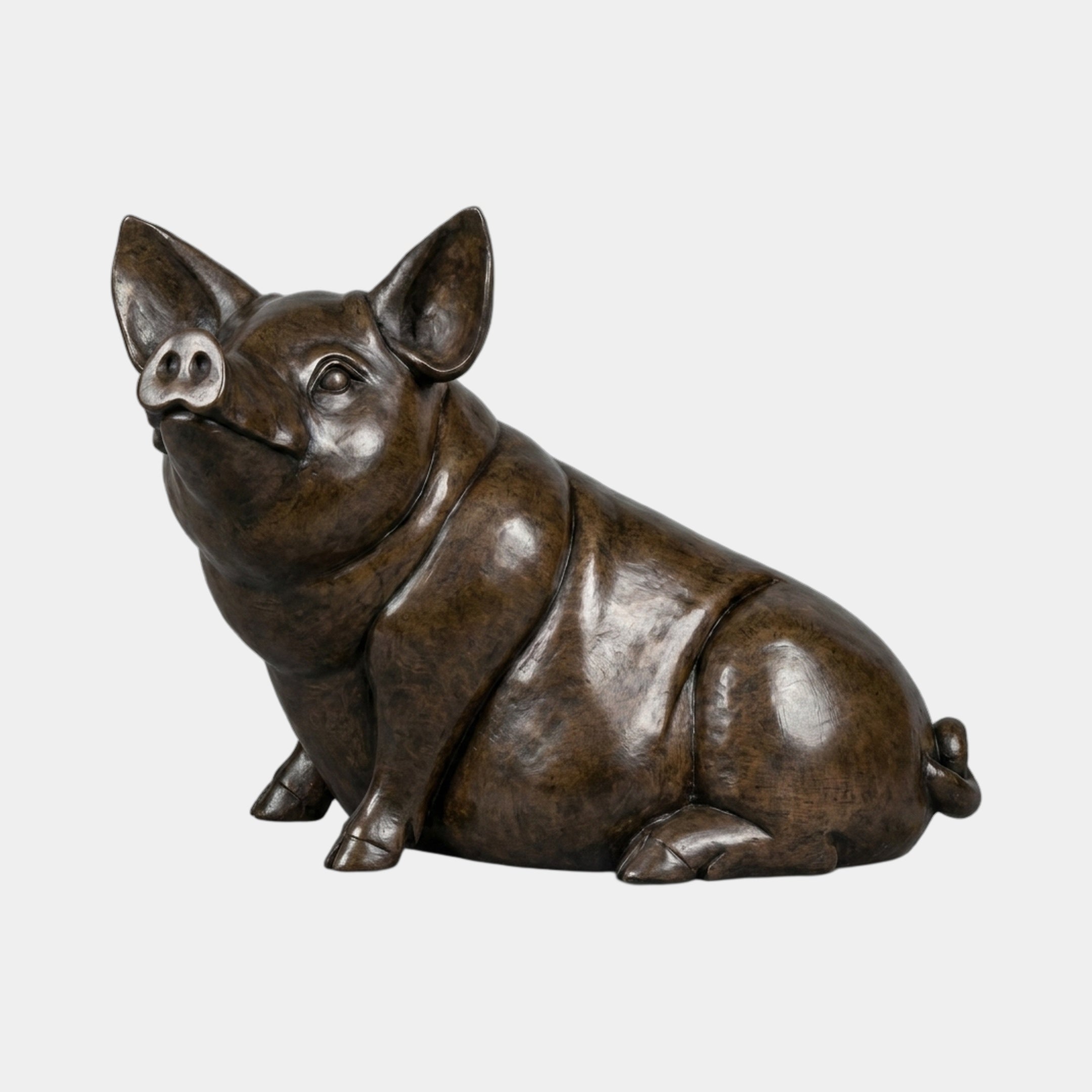 Life-Size Contemporary Seated Pig Bronze Sculpture by Giant Sculptures in warm brown patina, shown seated with snout tilted upward against a plain background.