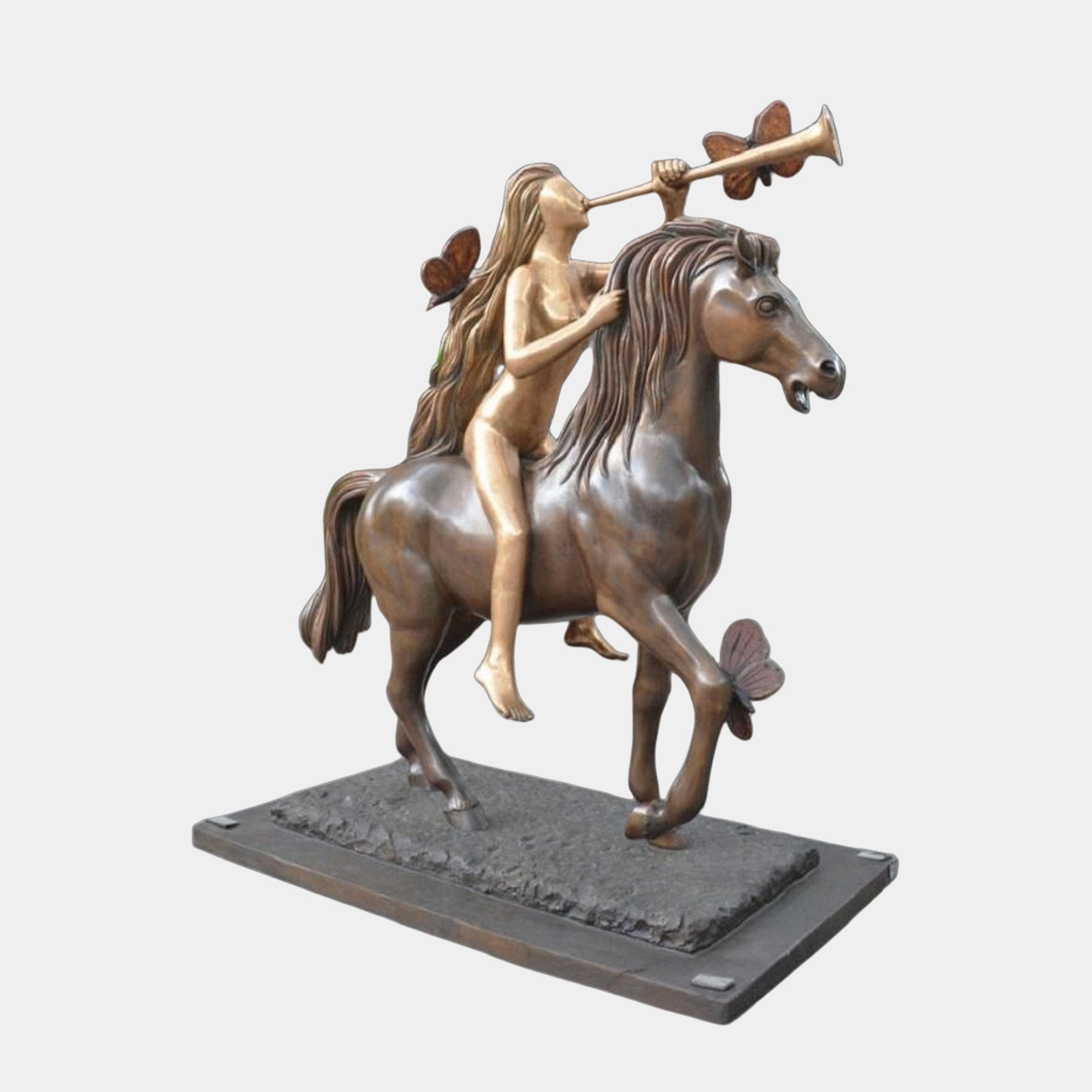 Life-Size Contemporary Winged Goddess and Horse Bronze Sculpture by Giant Sculptures, nude figure with trumpet on a rearing horse with butterflies, on plain grey.
