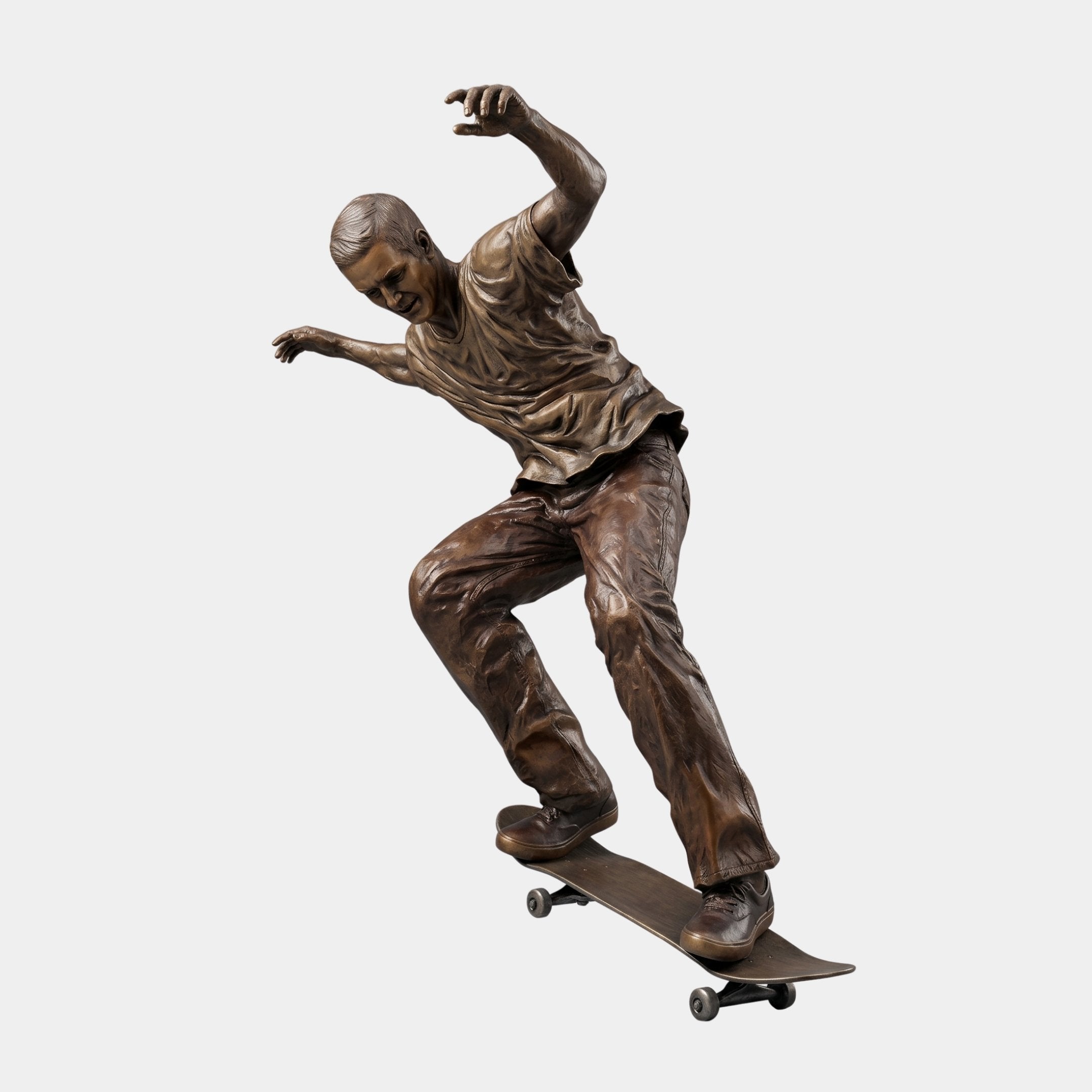 Life-Size Skateboarding Figure Bronze Sculpture by Giant Sculptures, showing a male figure mid-ride with arms flung wide on a bronze skateboard, plain background.