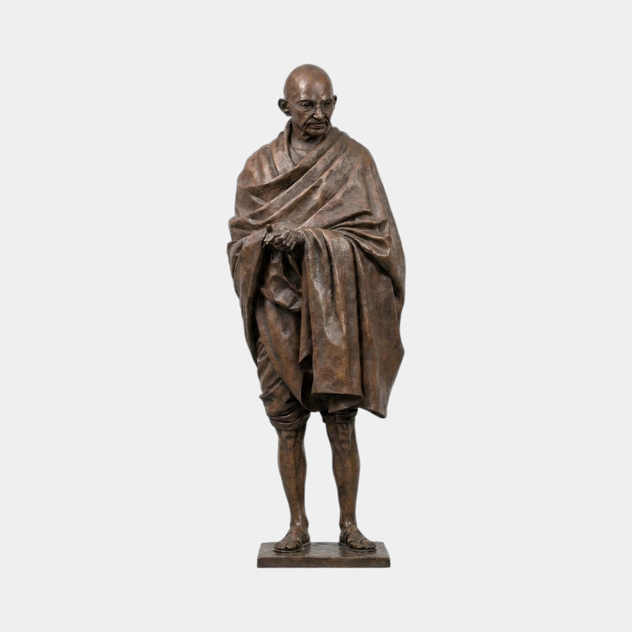 Life-Size Standing Gandhi Figure Bronze Statue by Giant Sculptures, 180cm, shown front-on with bowed head, clasped hands and draped shawl in warm brown patina.