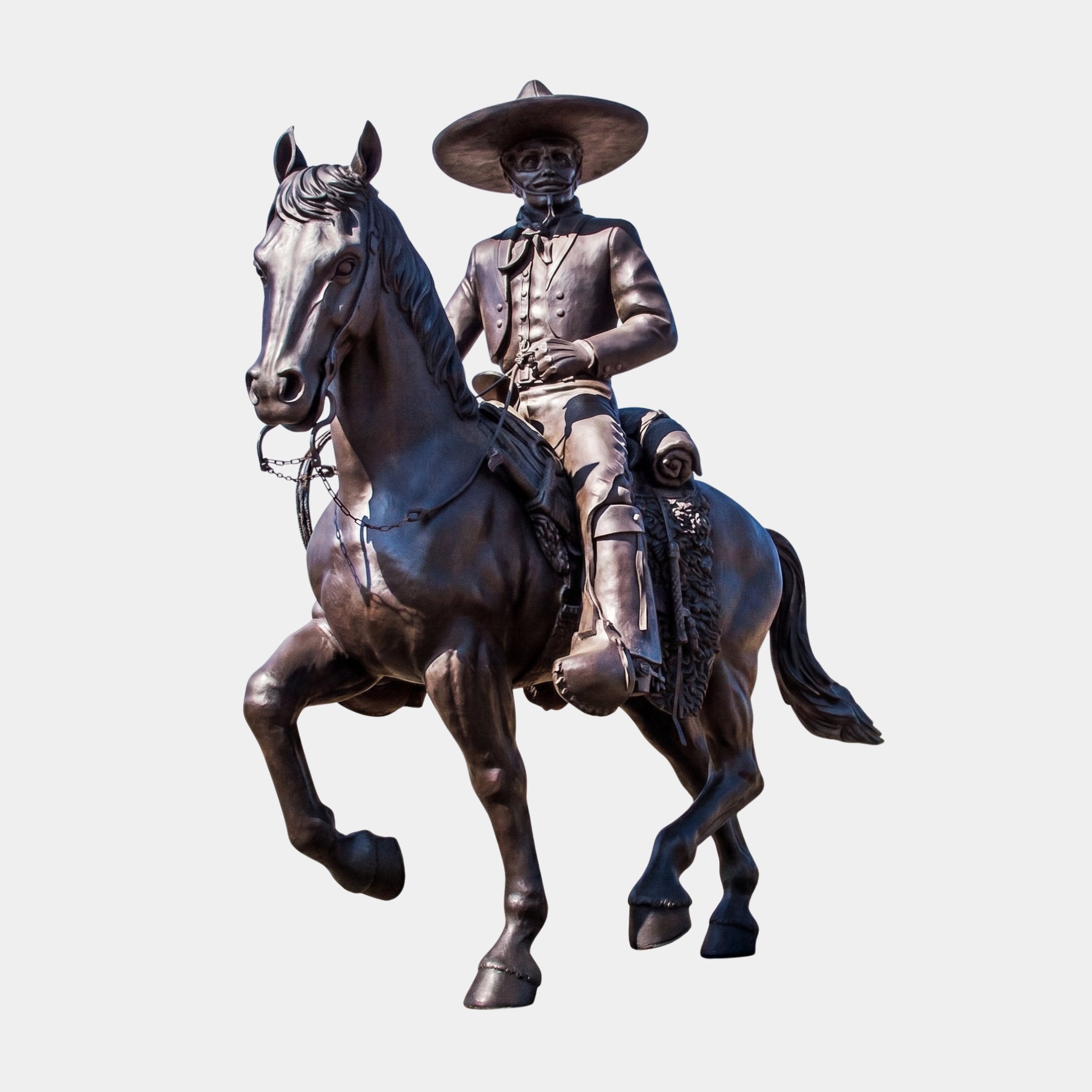 Life-Size Traditional Charro Rider and Horse Bronze Sculpture by Giant Sculptures, dark patina horseman in sombrero on a prancing horse, plain background.