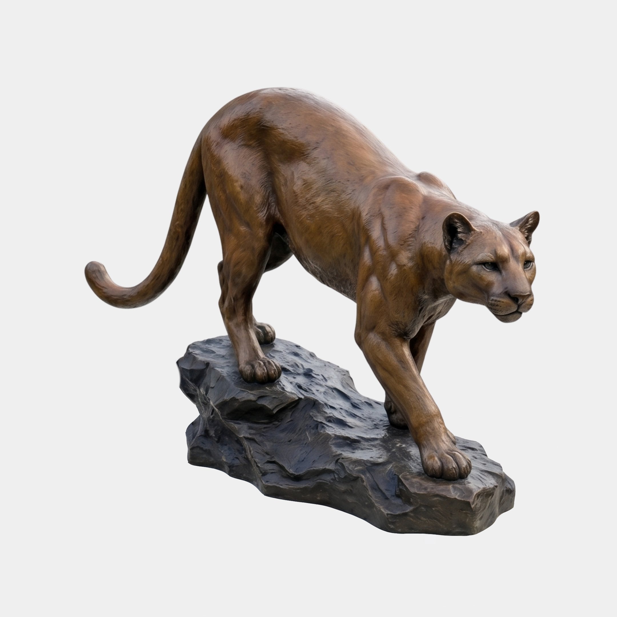 Life-Size Traditional Crouching Cougar Bronze Sculpture by Giant Sculptures, golden-brown patina cat descending a dark stone base, shown against plain grey.