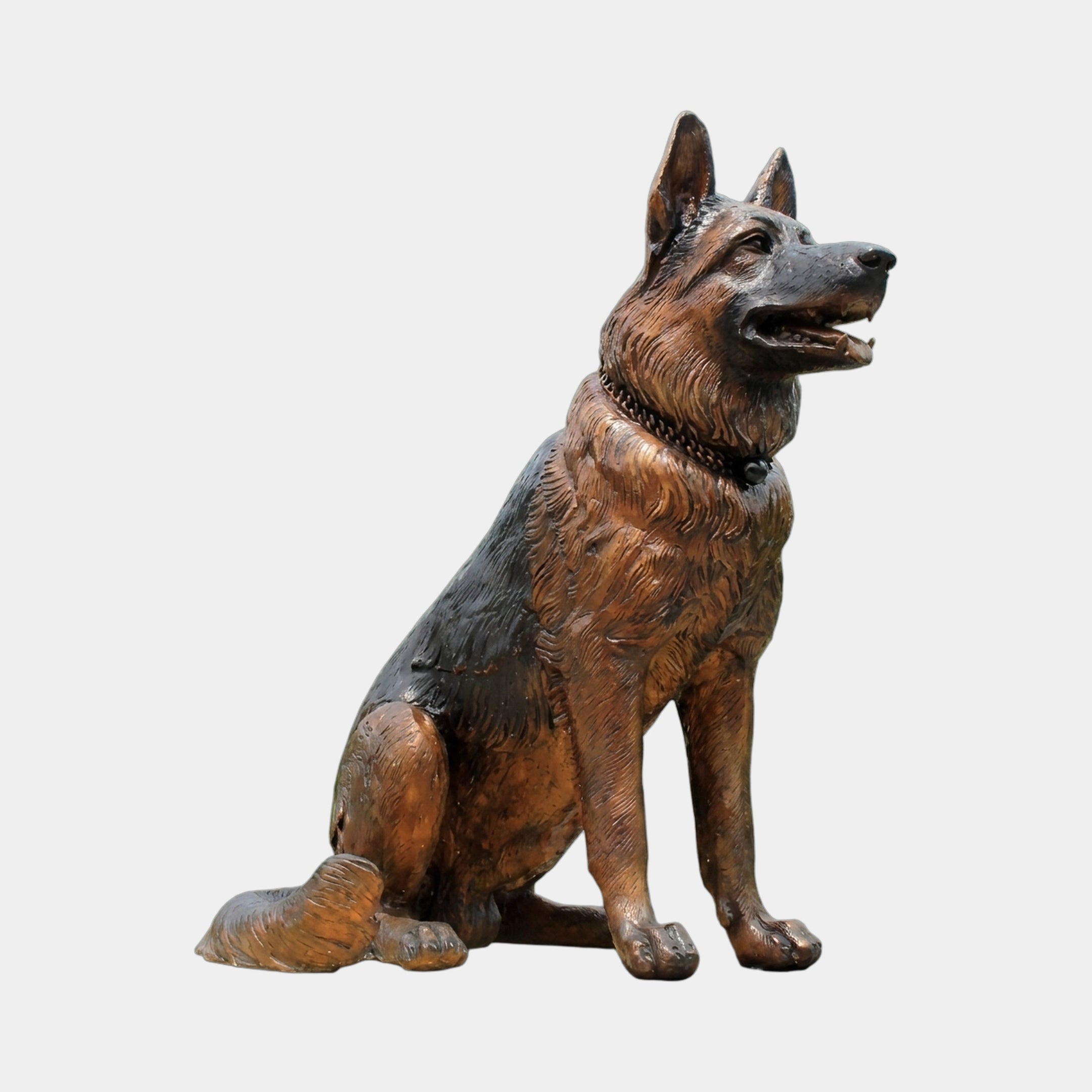 Life-Size Traditional German Shepherd Dog Bronze Sculpture by Giant Sculptures, seated with ears erect and mouth open, shown in side profile against a plain background.