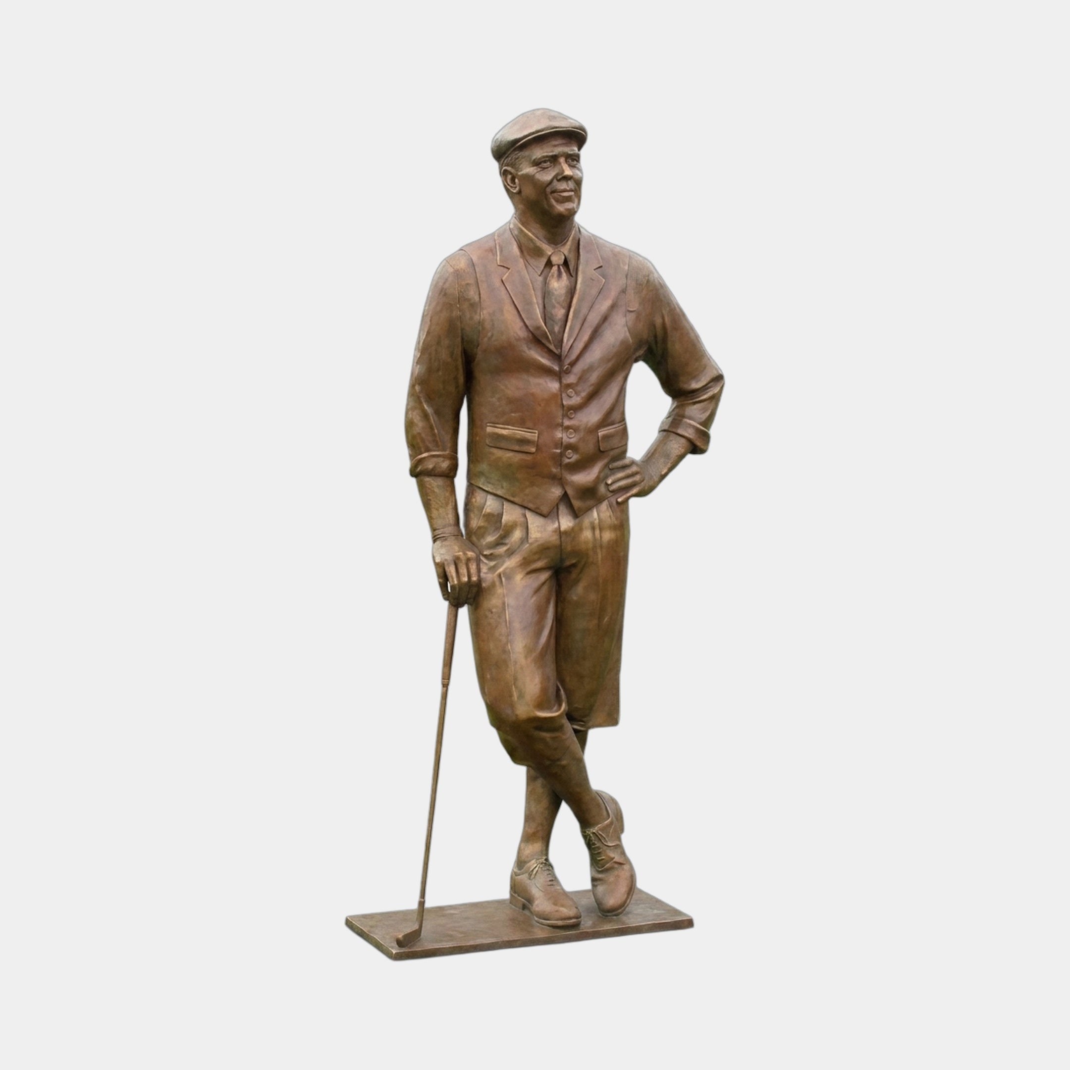 Life-Size Traditional Male Golfer Bronze Sculpture by Giant Sculptures, shown in warm mid-brown patina wearing a flat cap, waistcoat and knickerbockers, leaning on a club.