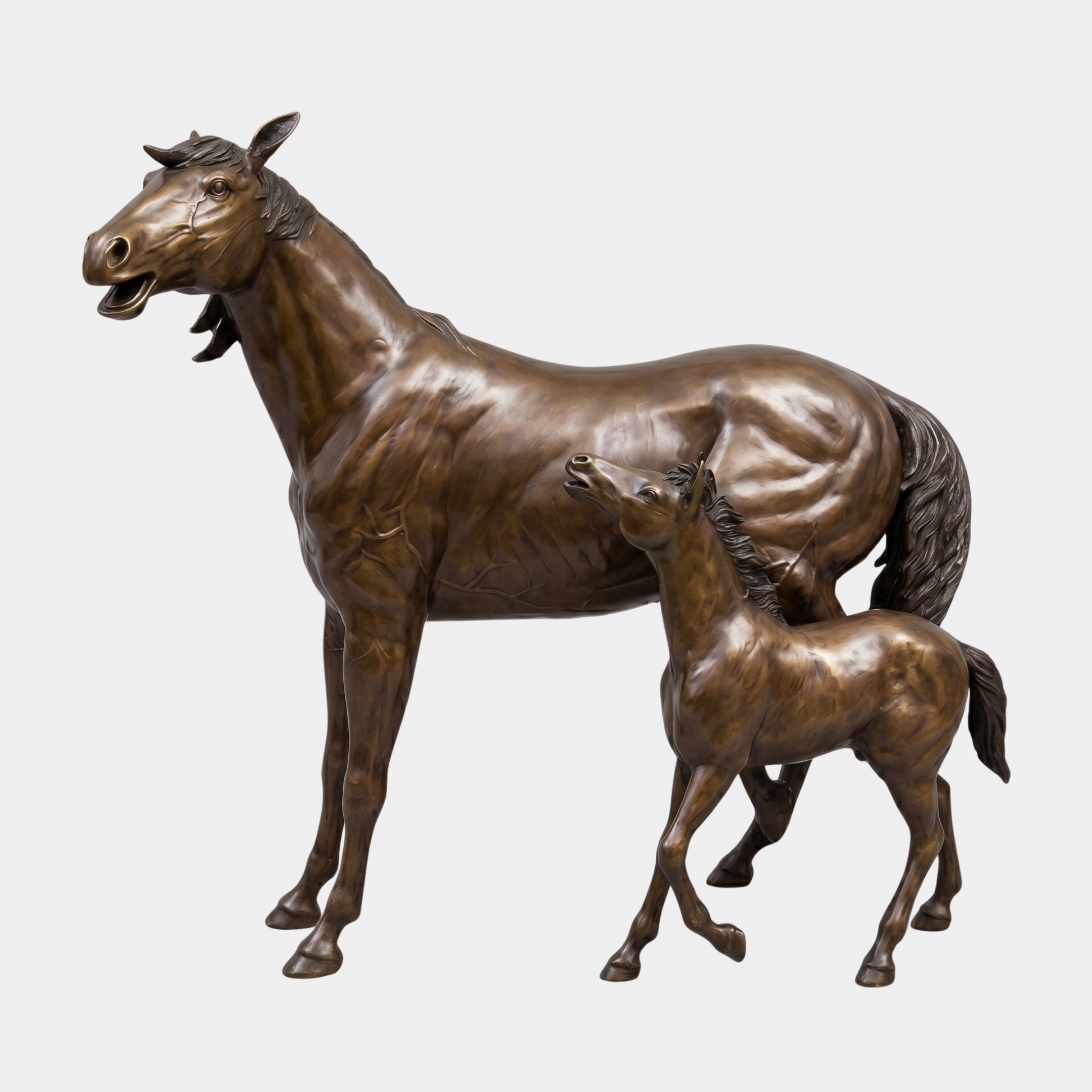 Life-Size Traditional Mare and Foal Bronze Sculpture 190cm by Giant Sculptures, warm brown patina with the foal nursing beside the mare on a plain background.