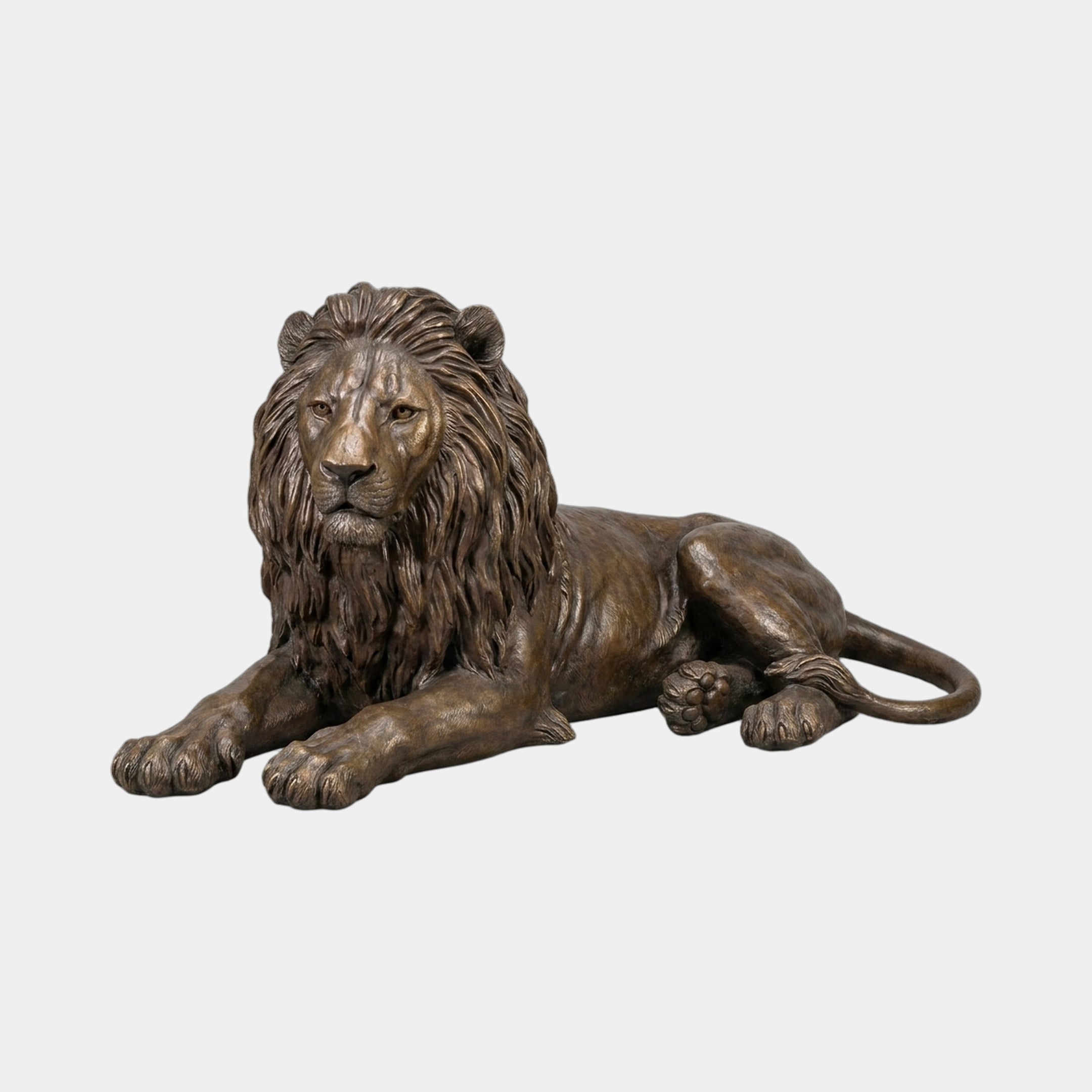 Life-Size Traditional Recumbent Lion Bronze Sculpture from Giant Sculptures, shown in three-quarter view with paws extended, flowing mane, and warm brown patina.